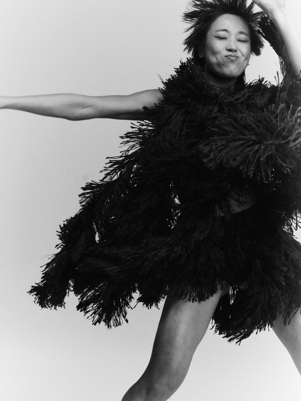 Emiri in Top & Skirt Alaïa, Socks stylist’s own, Shoes Vagabond, all Jewellery model’s own