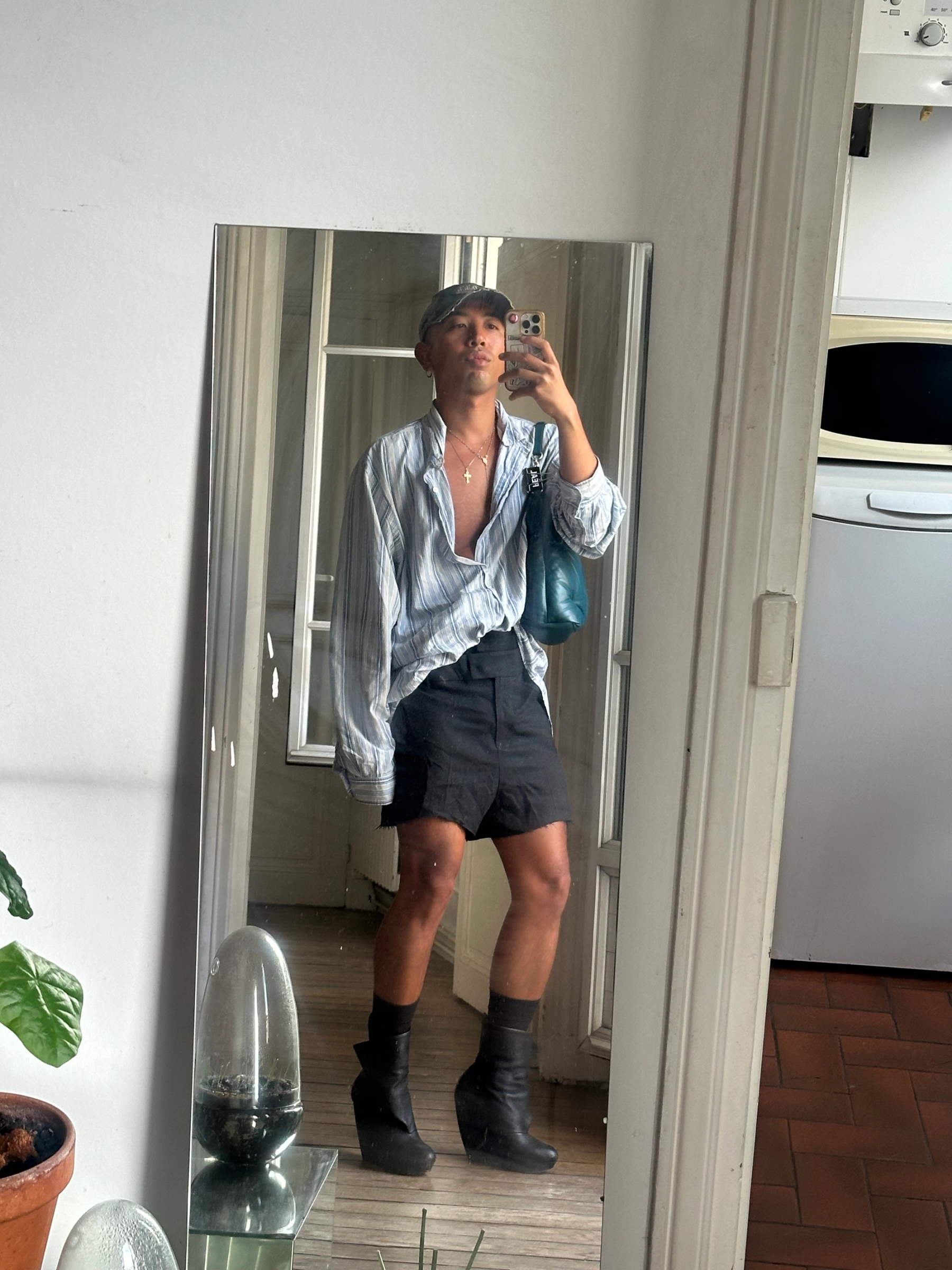 Cap: Dsquared2 / Shirt: Ralph Lauren / Bag: Margiela / Shoes: Balenciaga by Nicolas Ghesquière / Shorts are vintage/unknown