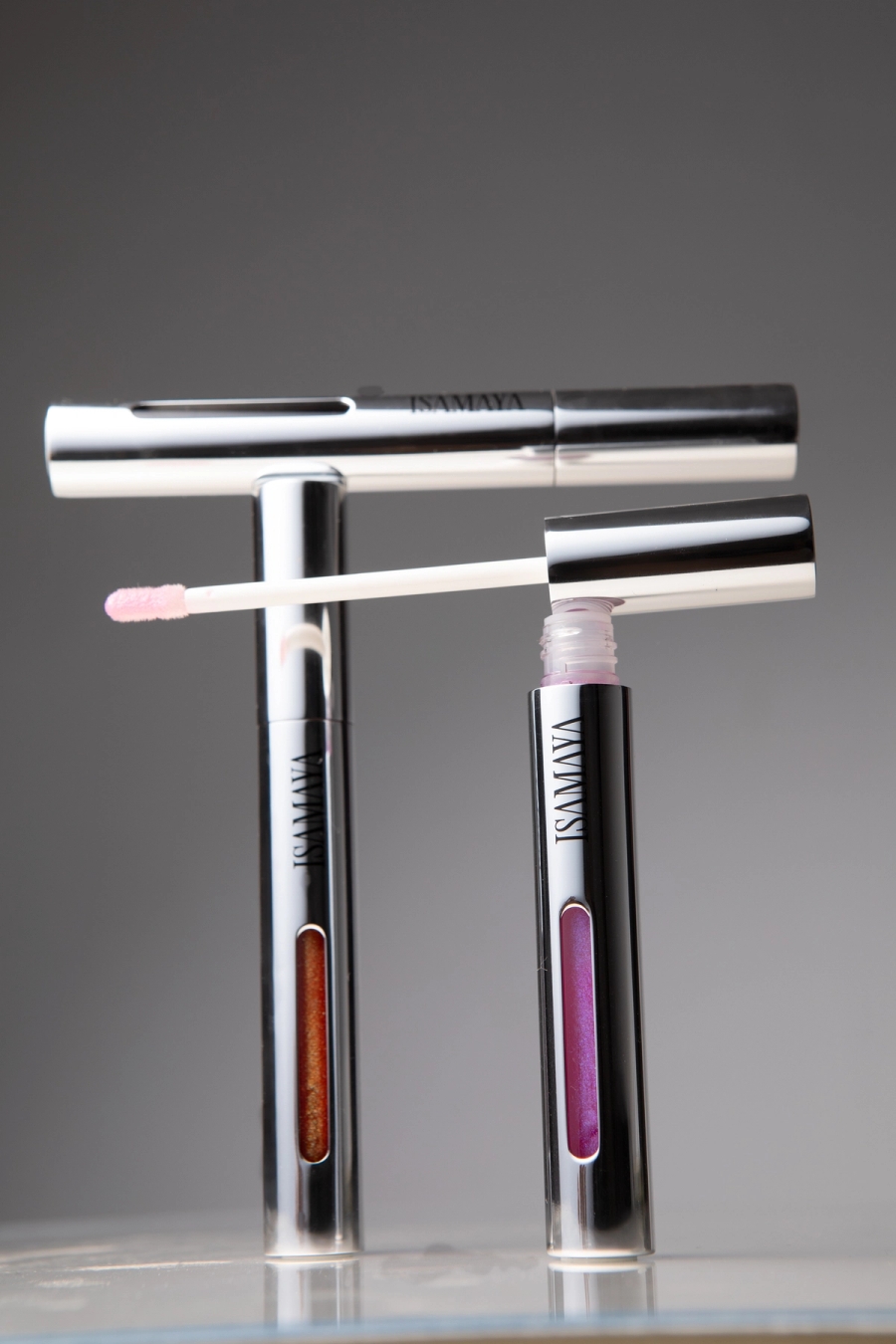 Left to right: Isamaya Beauty Lip Lacq | Merit Retrospect Parfum, Asics Gel Kayano 14 
