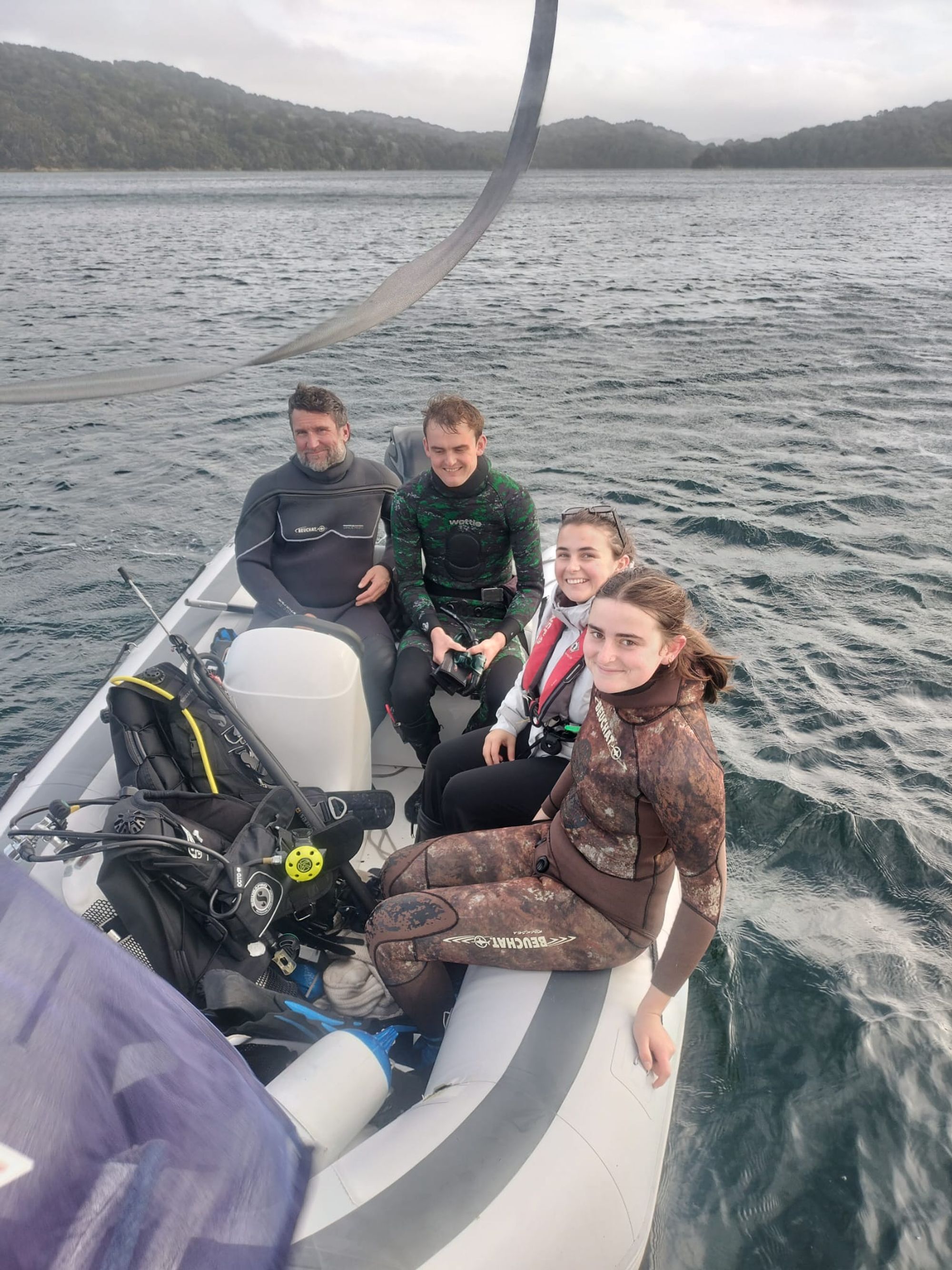 The Matariki III dive team suited up — ready for another Fiordland freedive session