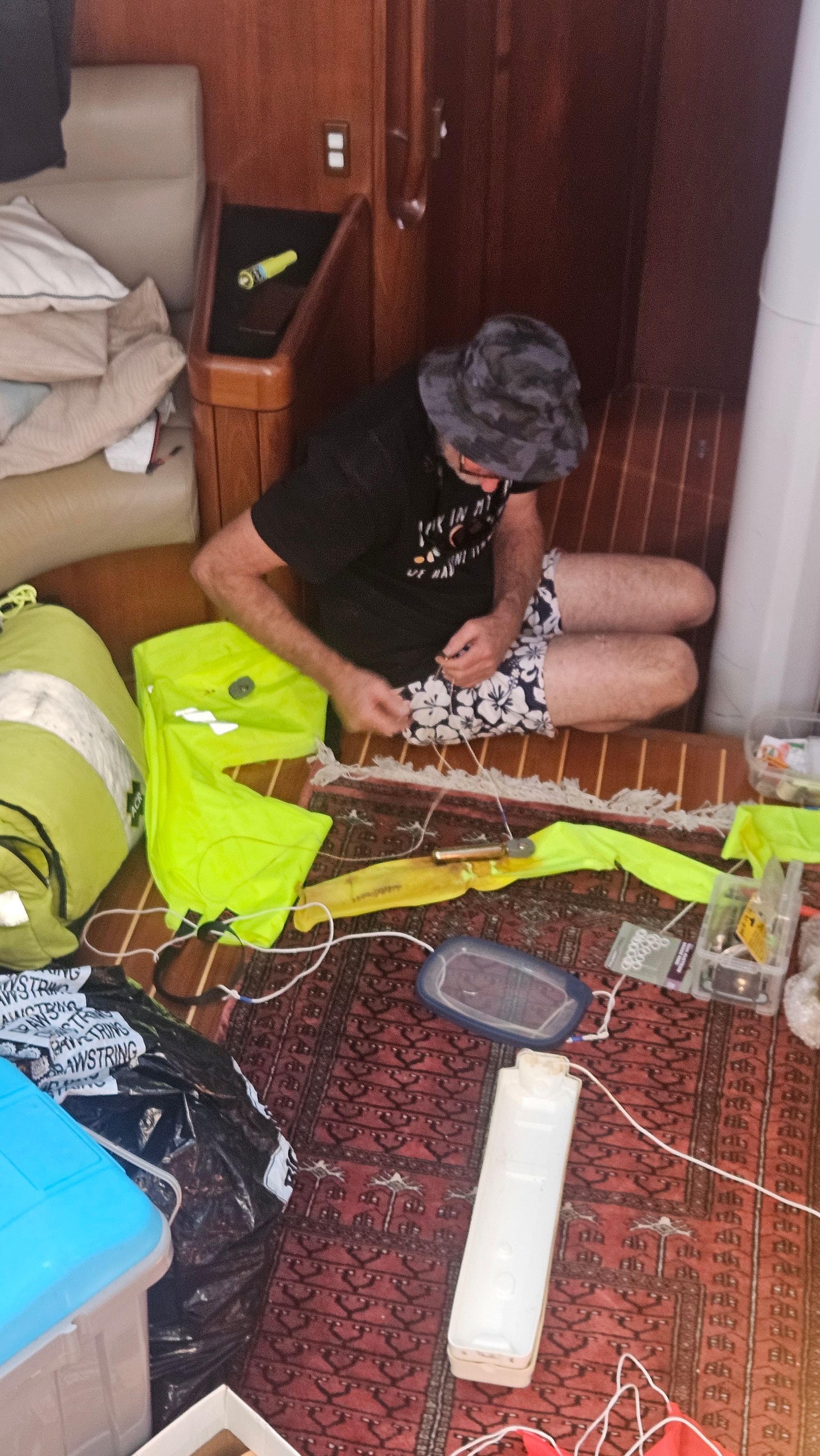 Bruce repacking the inflatable danbuoy on the saloon floor after it went overboard during the Cape Reinga tuna fight