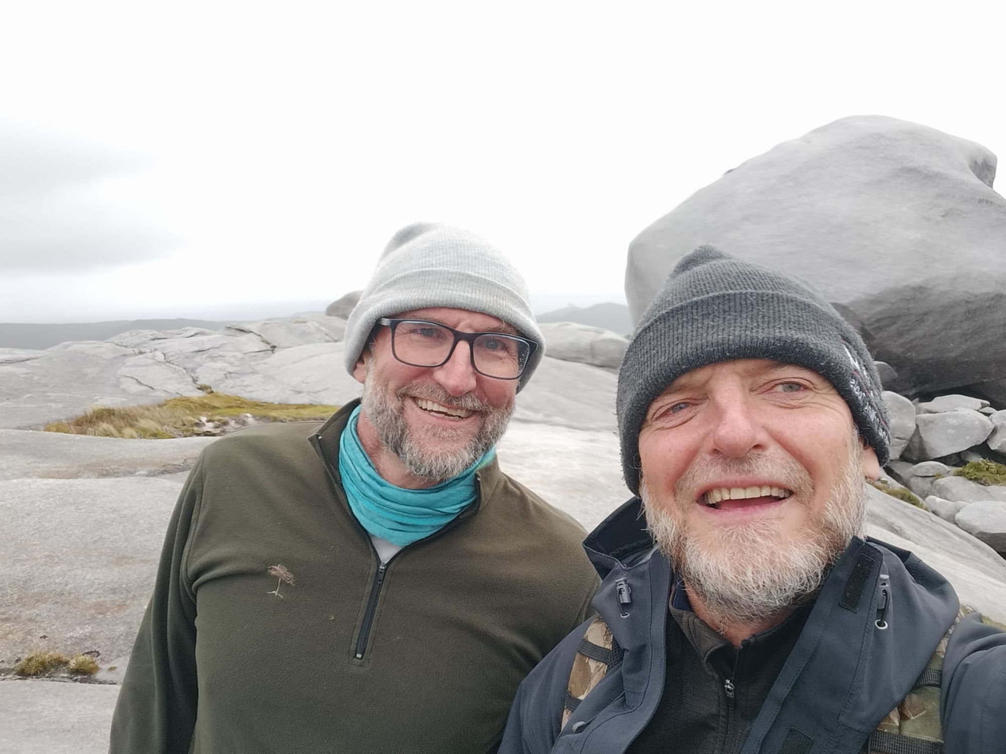 Greg and Bruce on the summit of Bald Peak, Stewart Island, views over the southern channels behind them