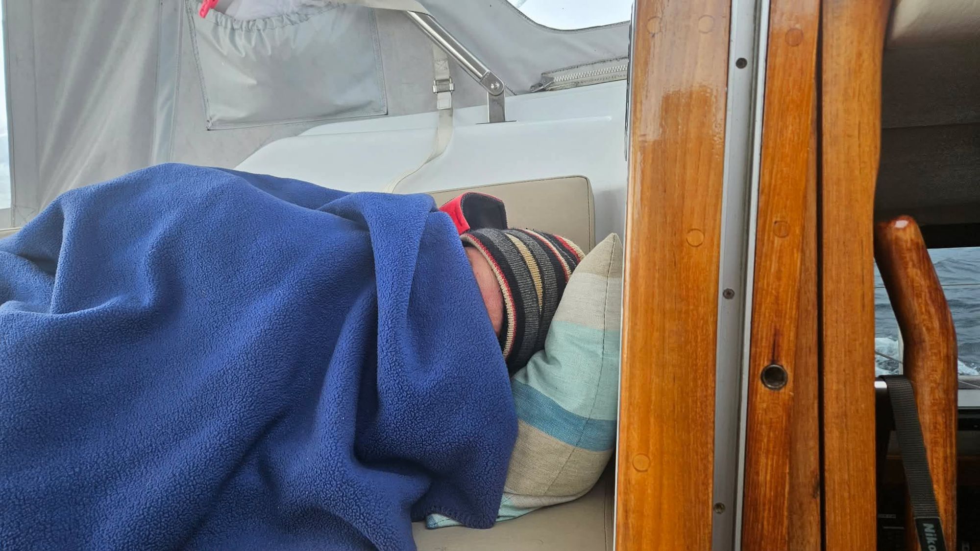 Bruce, aka Mr Sleepy, fast asleep in his customary underway position aboard Matariki III on the Southern Ocean passage