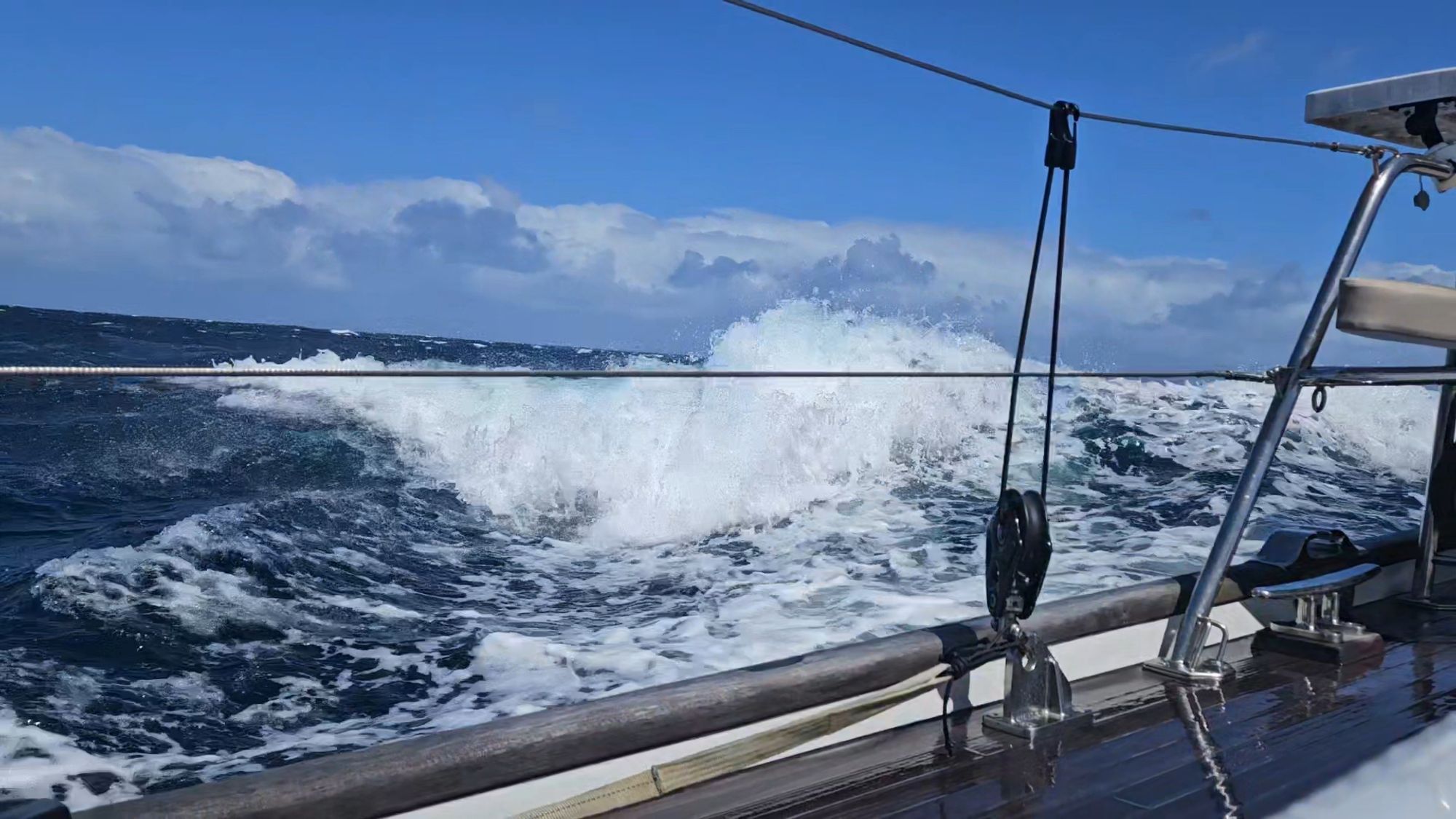 Large breaking wave over Matariki III's stern in the Tasman Sea