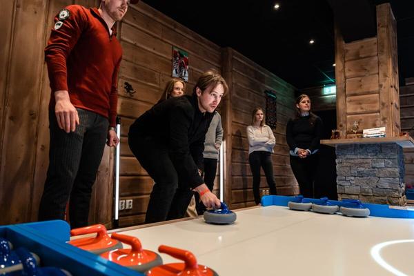 Men playing streetcurling