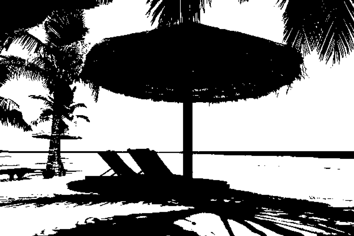 Beach lounge chairs under umbrella with palm trees and ocean view