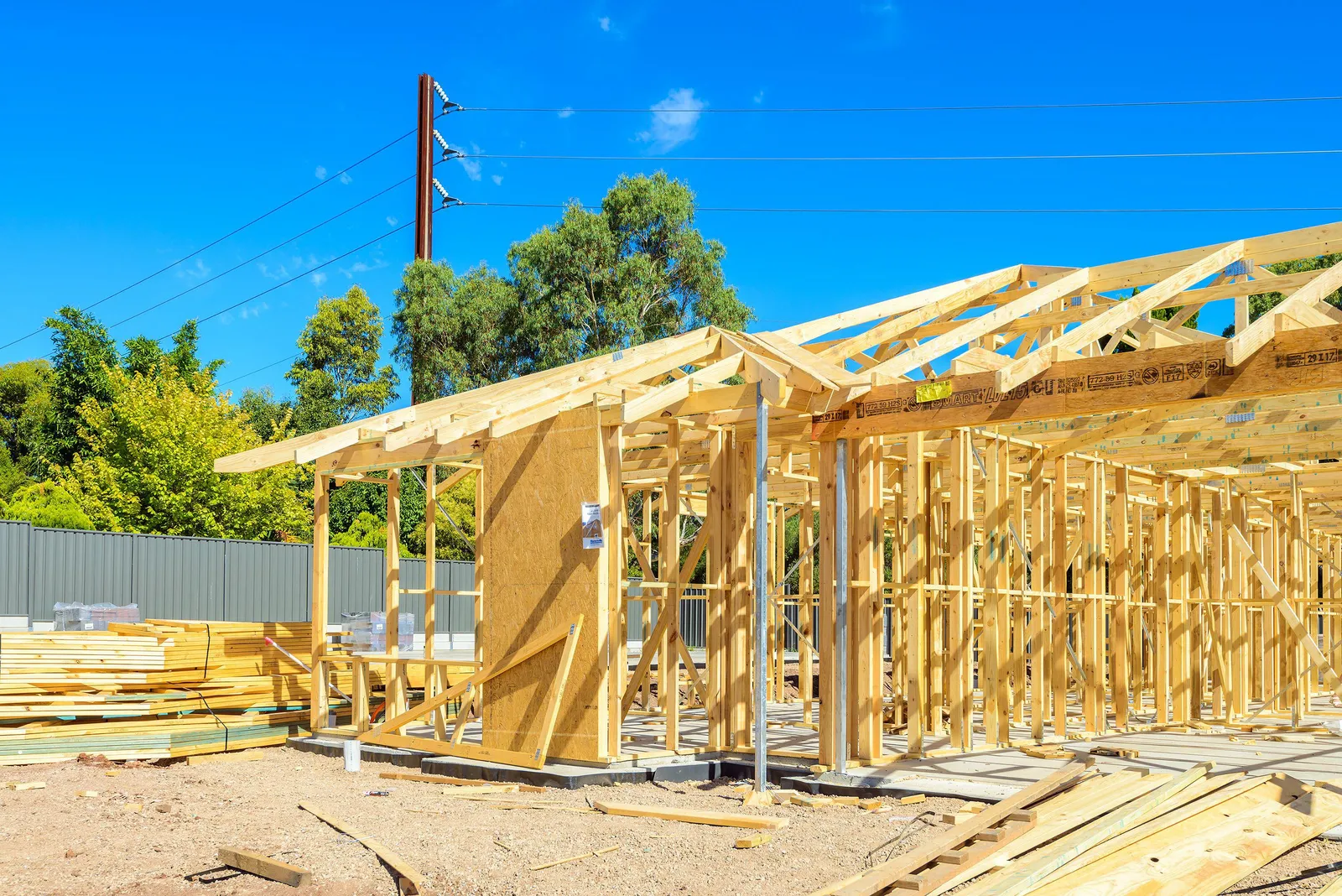 A photo of a house frame in a residential area.
