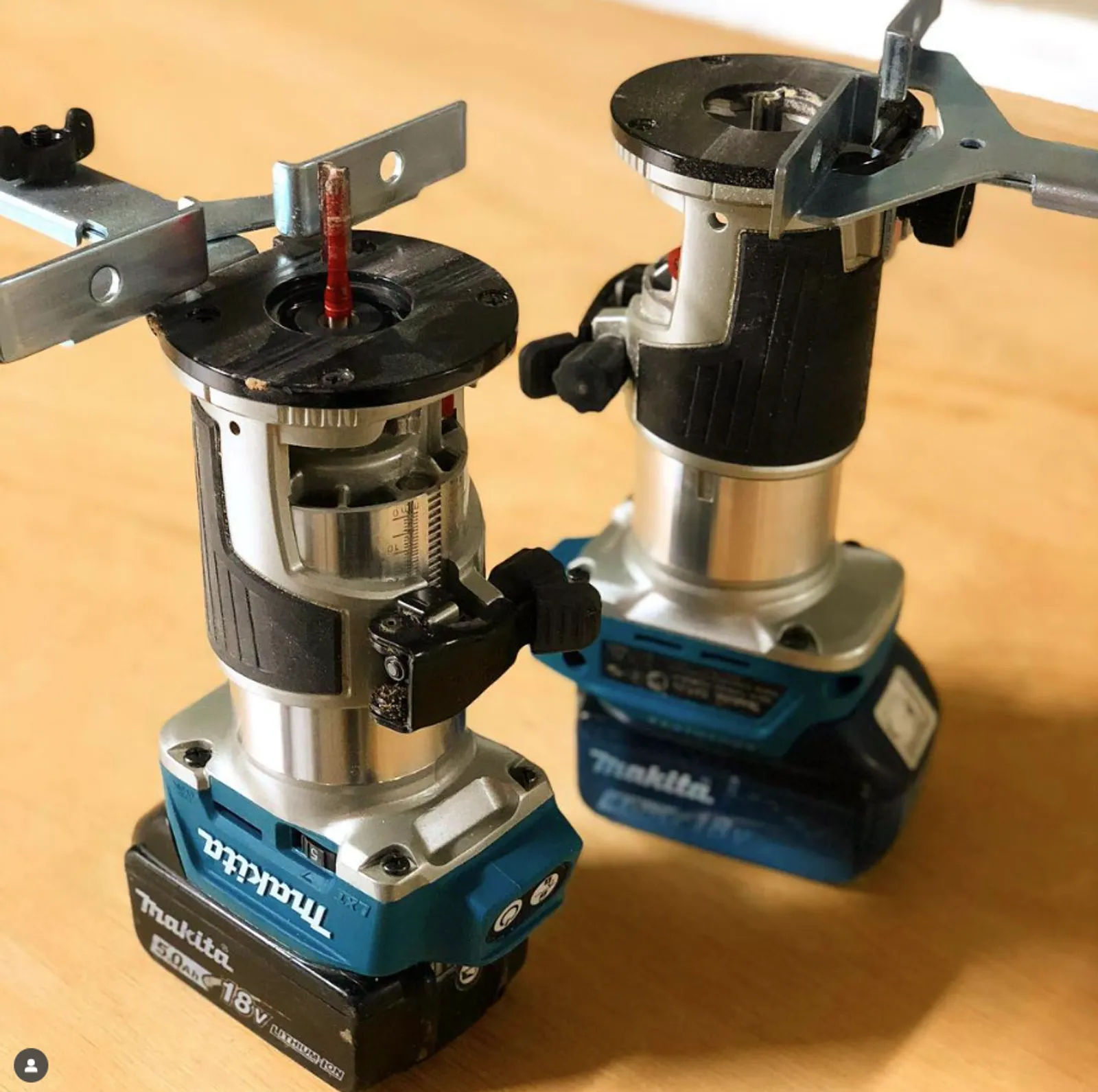 Two woodworking routers in a workshop