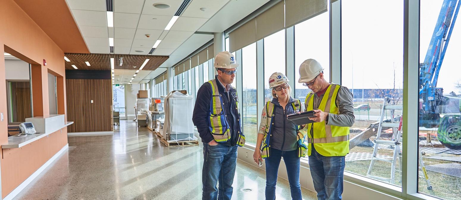 Workers looking at plans
