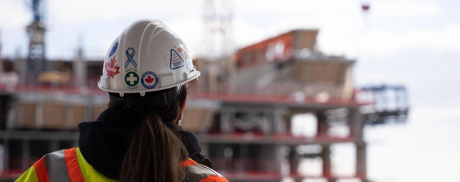 Worker overlooking construction site