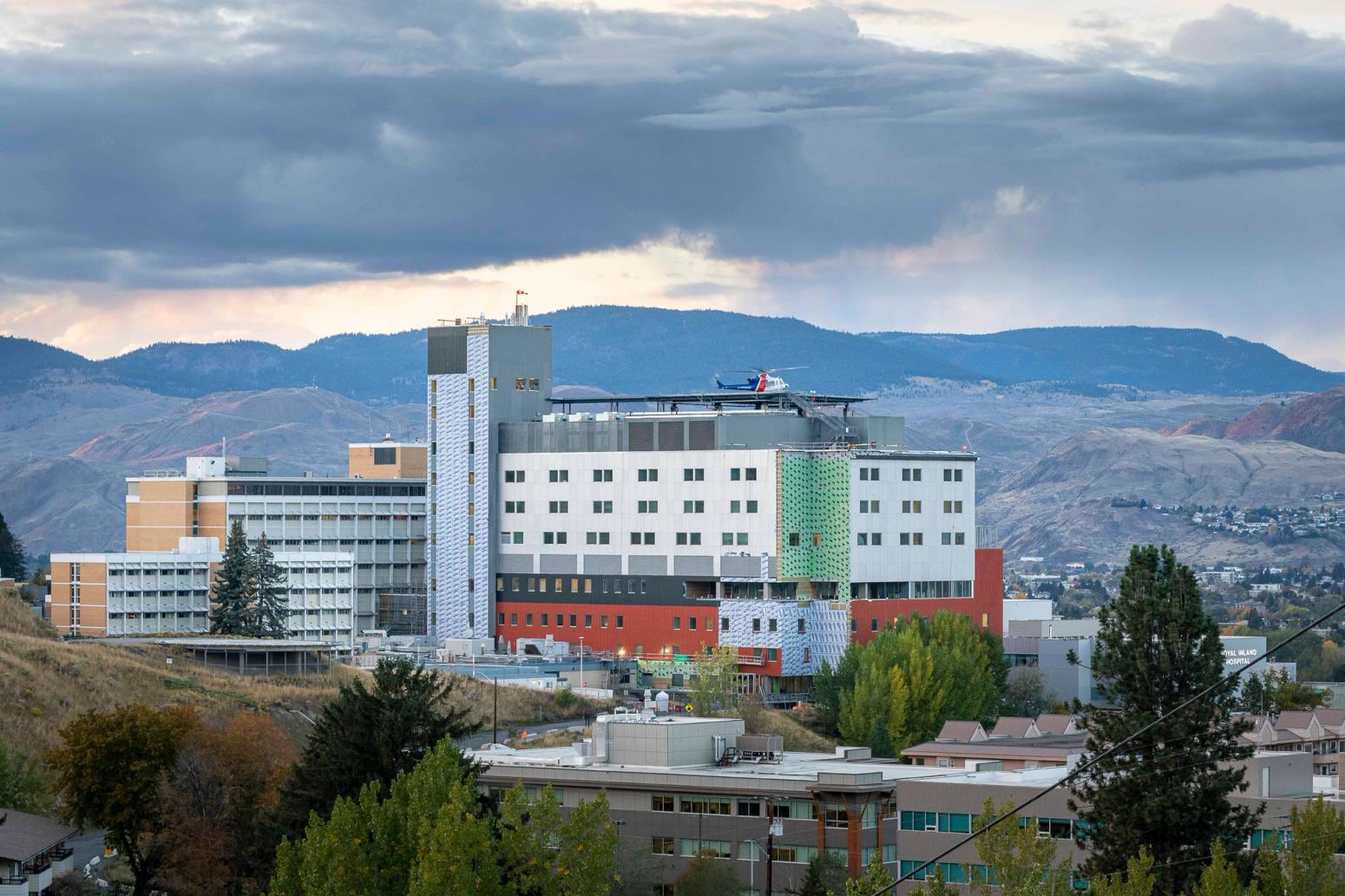 Exterior shot of building near mountain rangenge