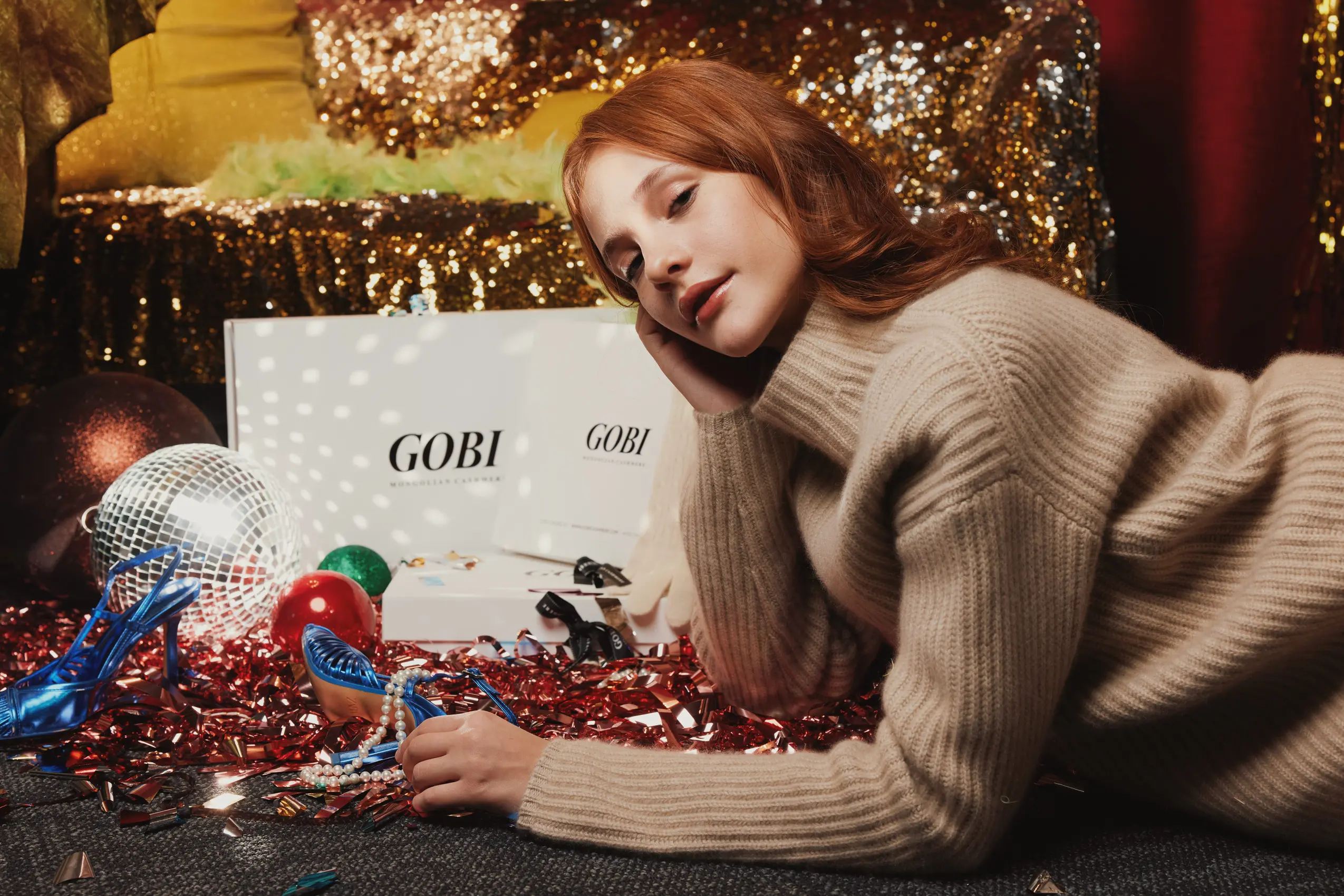 model lying on the ground with gobi cashmere