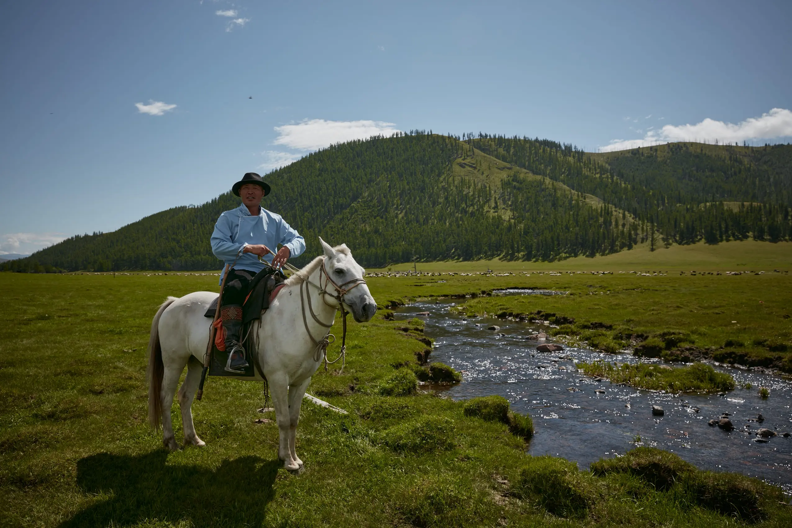 mongolian horseman by a river