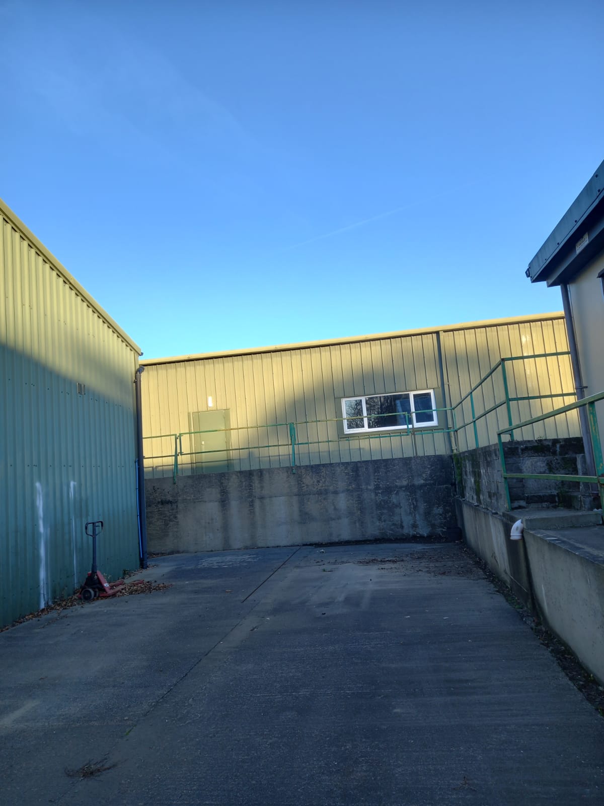 Clean carpark behind some warehouses in Jersey