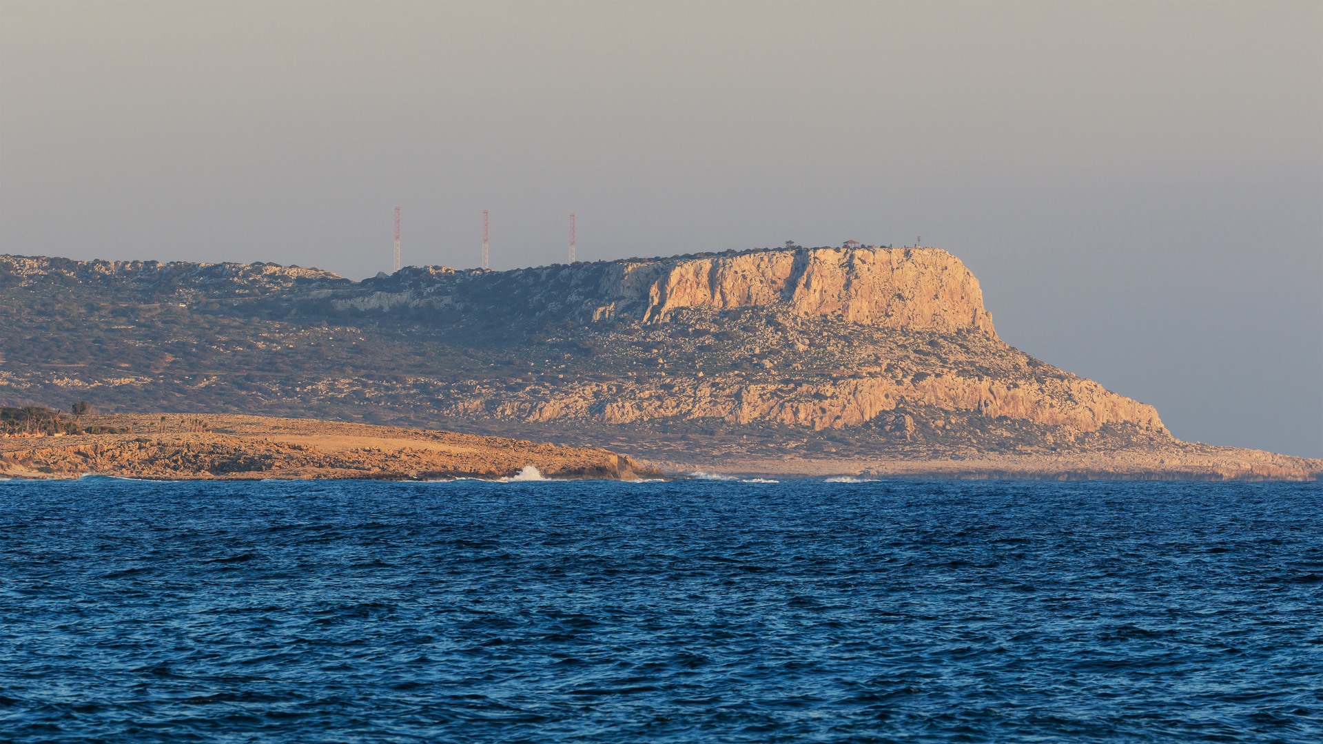 Cape Greco rocky coastline near Paralimni at sunset