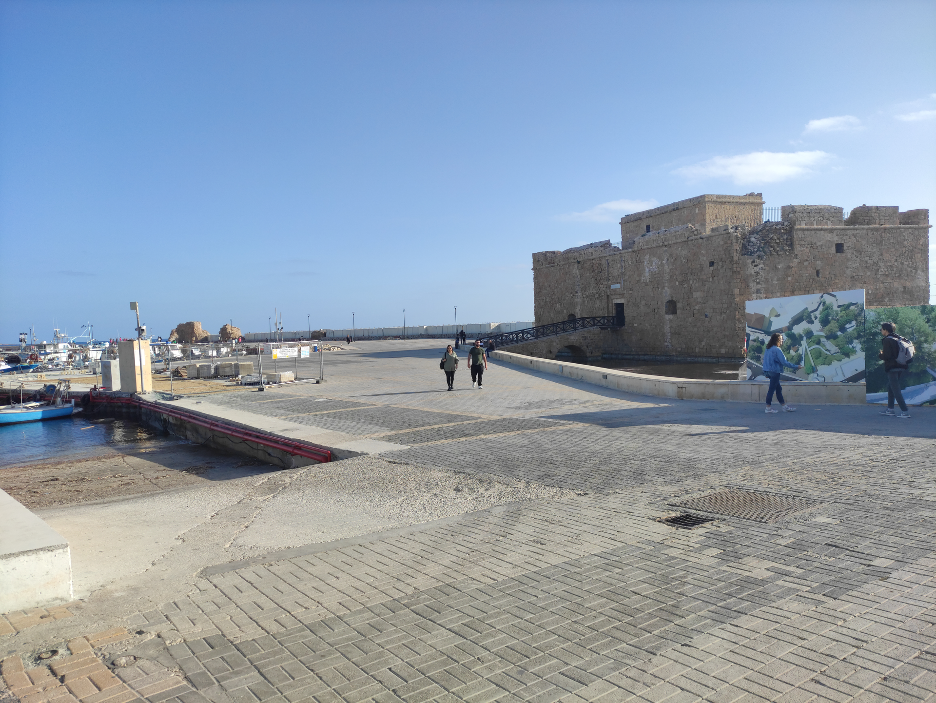 Paphos Castle and Marina with boats at golden hour
