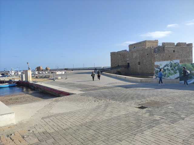 Paphos Castle and Marina with boats at golden hour