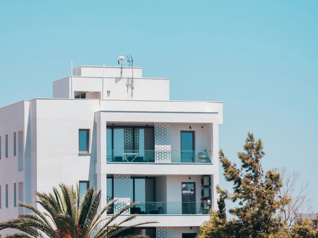 White building with palm trees for Cyprus residence permit