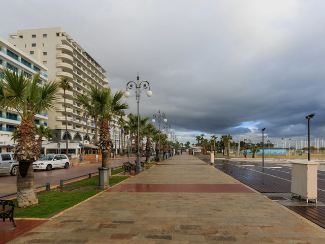 Finikoudes promenade in Larnaca with palm trees and beachfront