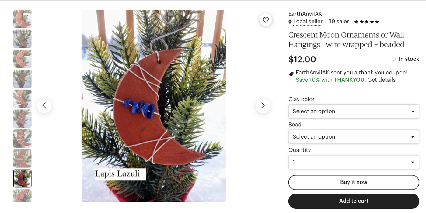 An Etsy listing showing a half moon ornament made with clay and lapis lazuli.