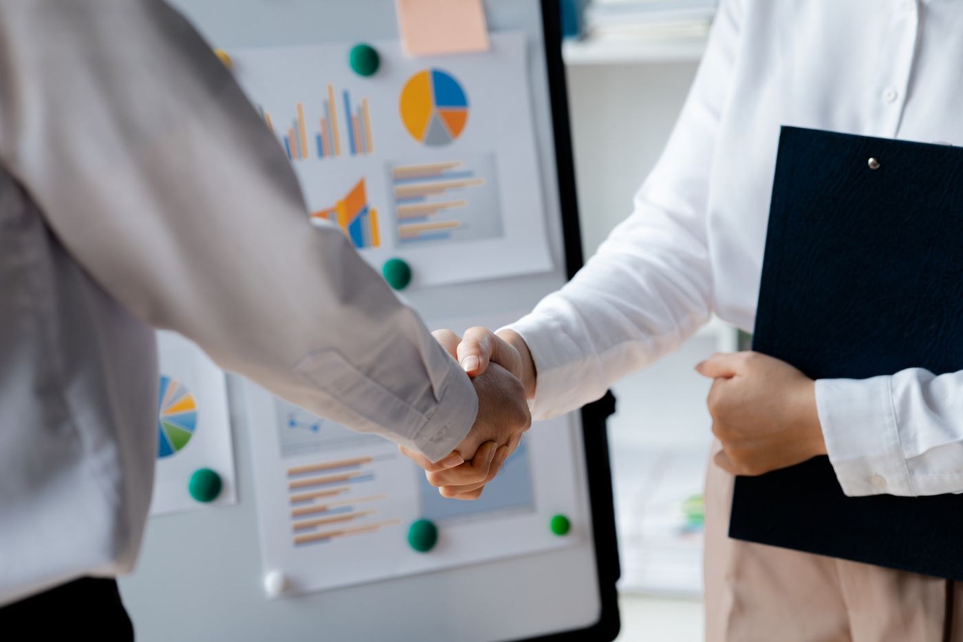 How to sell your app ideas: Business investor group shaking hands.