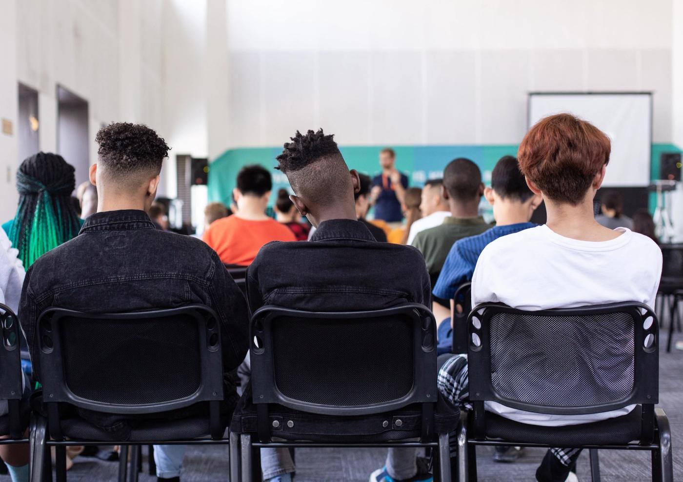 Young people listening in a classroom