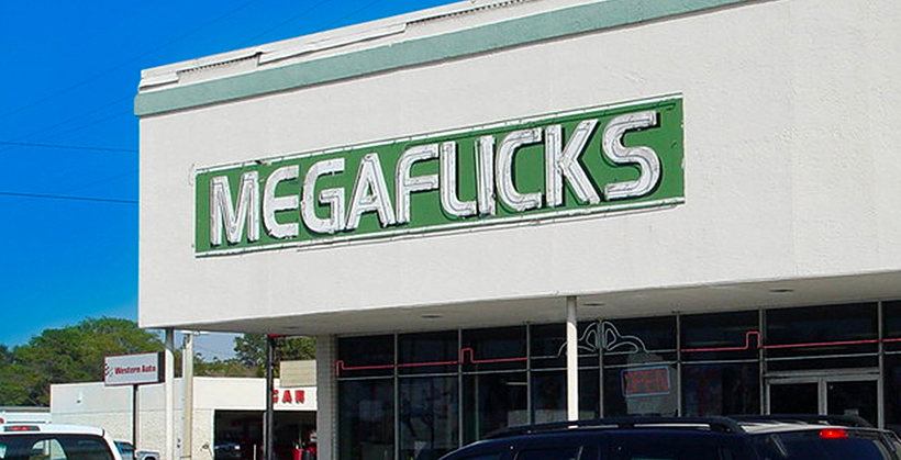 Megaflicks logo on the side of a building
