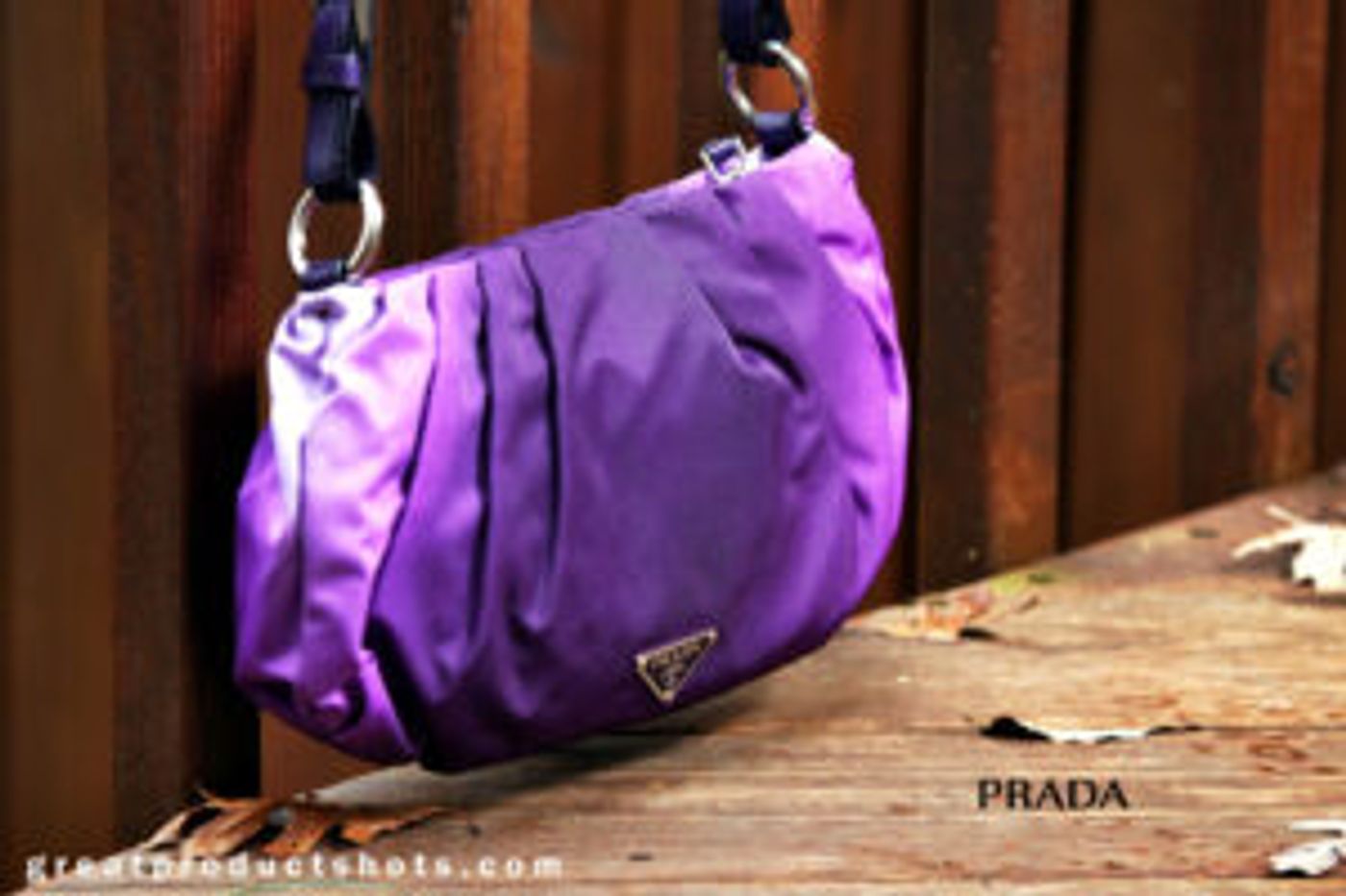 Imitate the pros with your DIY product photography, as this handbag against a wooden fence 