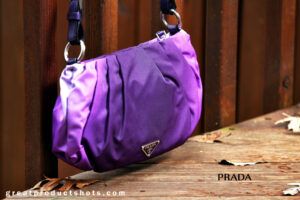 Imitate the pros with your DIY product photography, as this handbag against a wooden fence