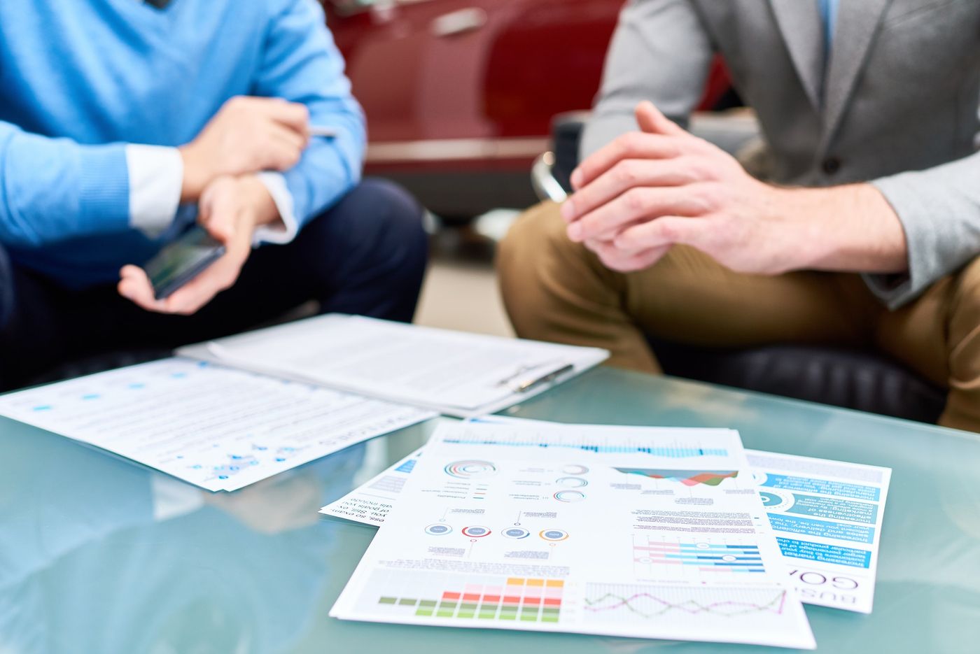 Amazon Manage Your Experiments: sales data and charts on a coffee table 