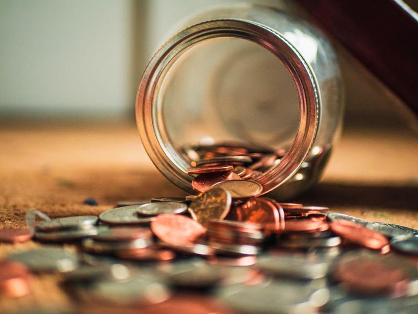 Price sensitivity coins spilling out of a jar