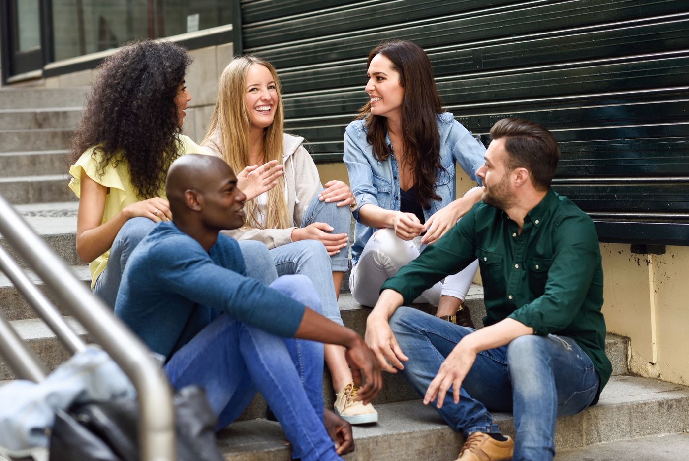 message testing: Group of friends having fun together outdoors