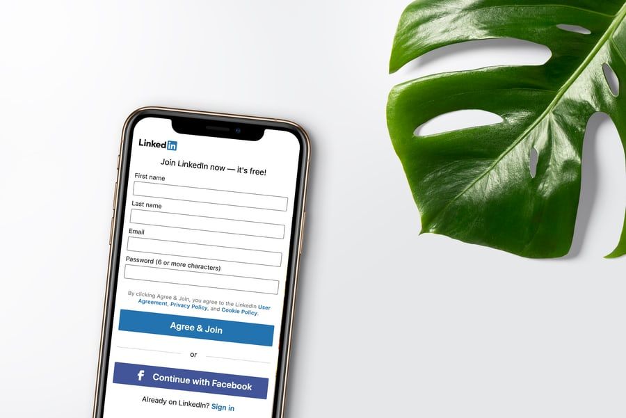 Best LinkedIn profile and cover photos: image of a phone with the LinkedIn app on the screen