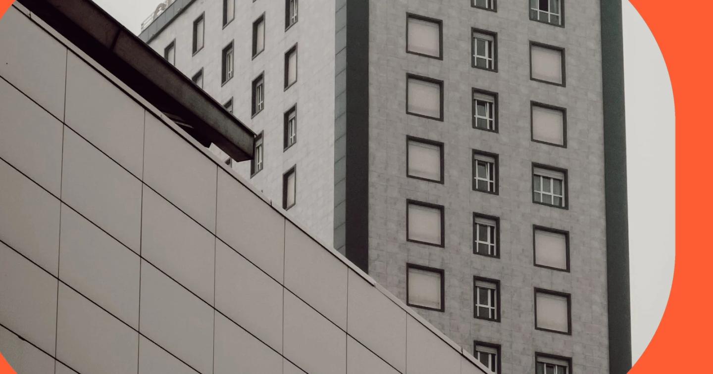Repeating windows and clean geometric lines on a modern city building.