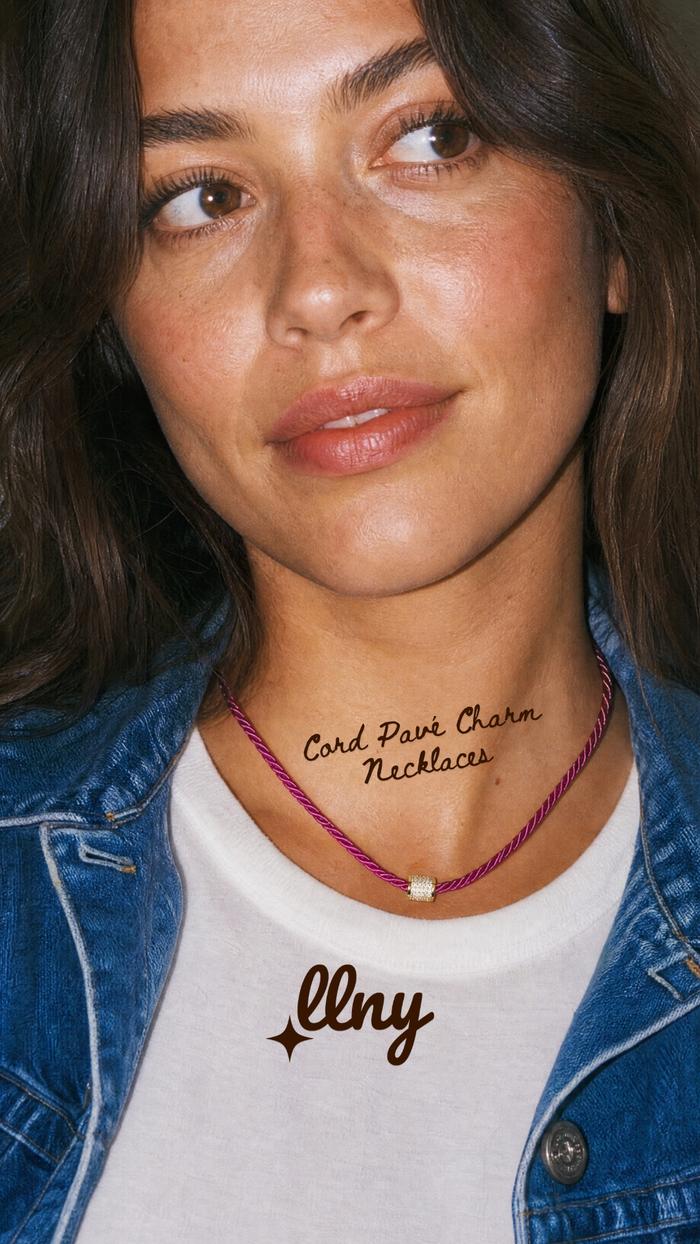 Women wearing a denim jacket and white t-shirt wearing a La Lumiere New York pink cord necklace.