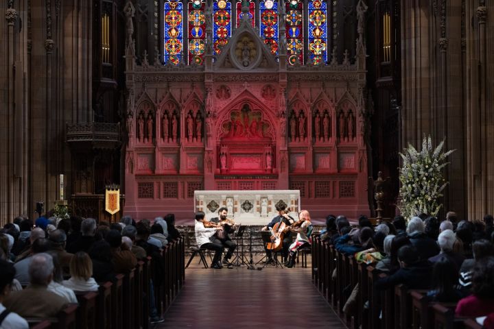 A string ensemble playing in the nave of Trinity Church Wall Street