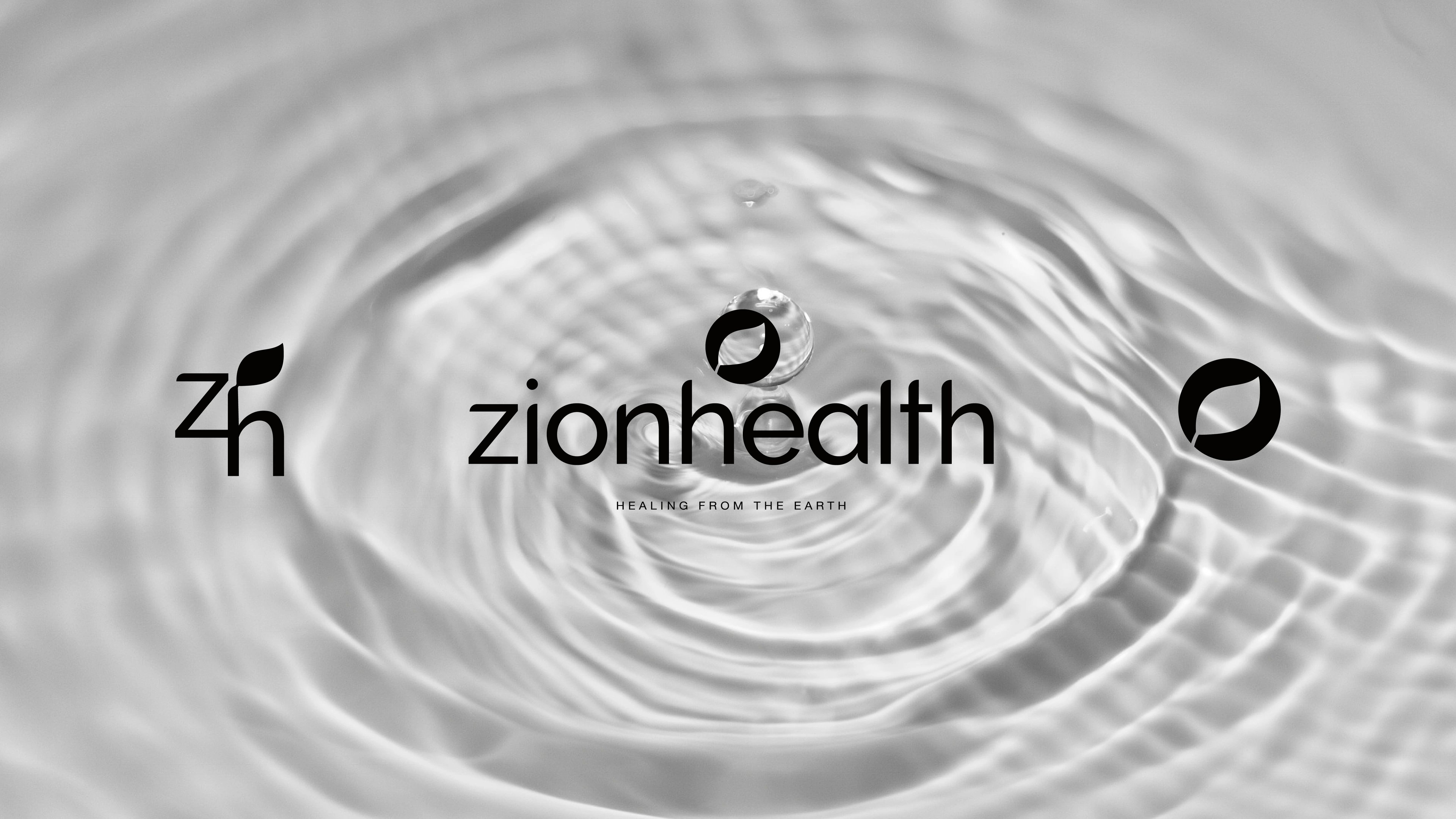 Zion Health logo lockup — the zionhealth wordmark, zh monogram, and leaf seal over a rippling water surface
