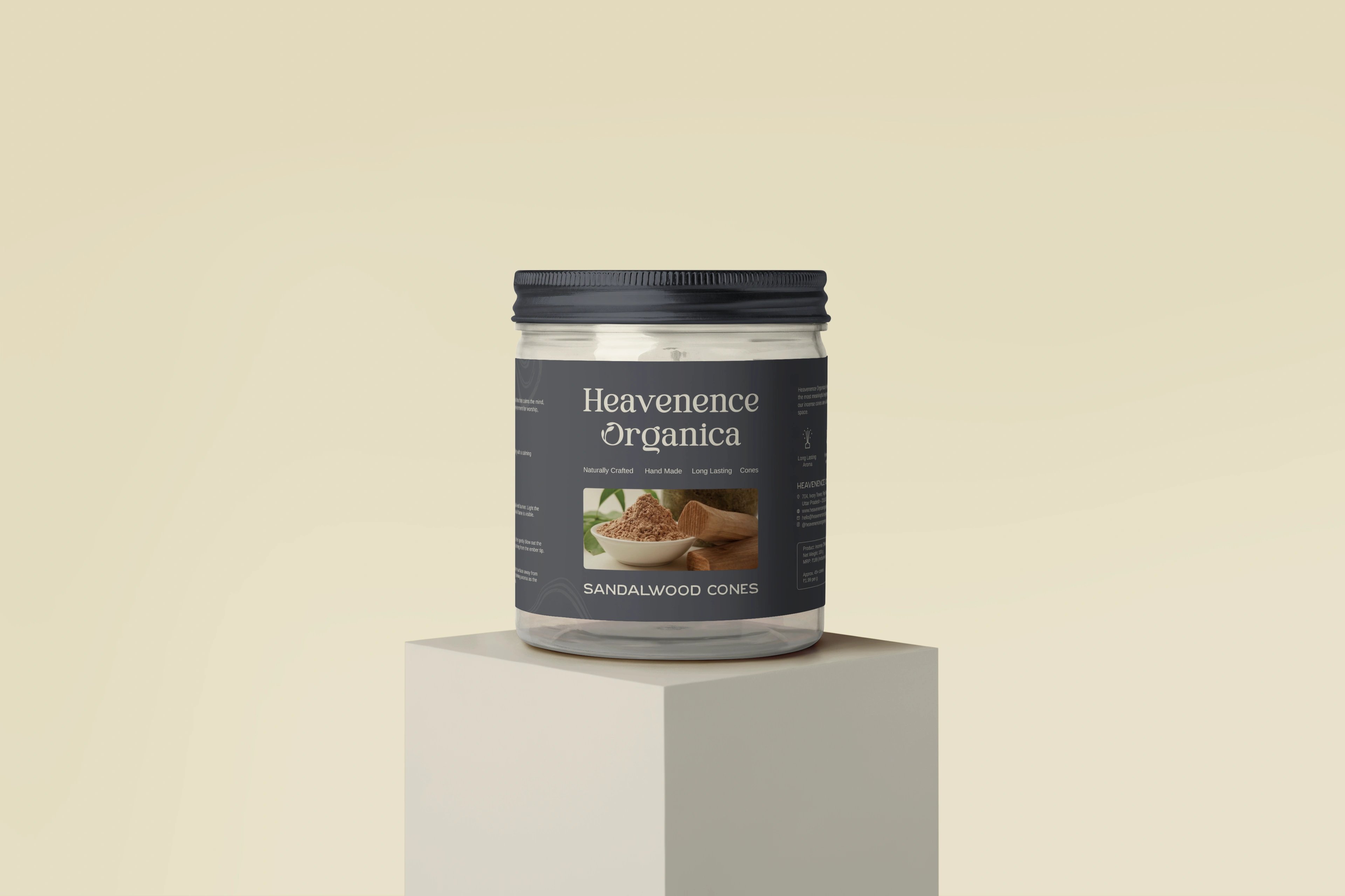 Heavenence Organica Sandalwood Cones in a charcoal-lidded jar on a cream plinth