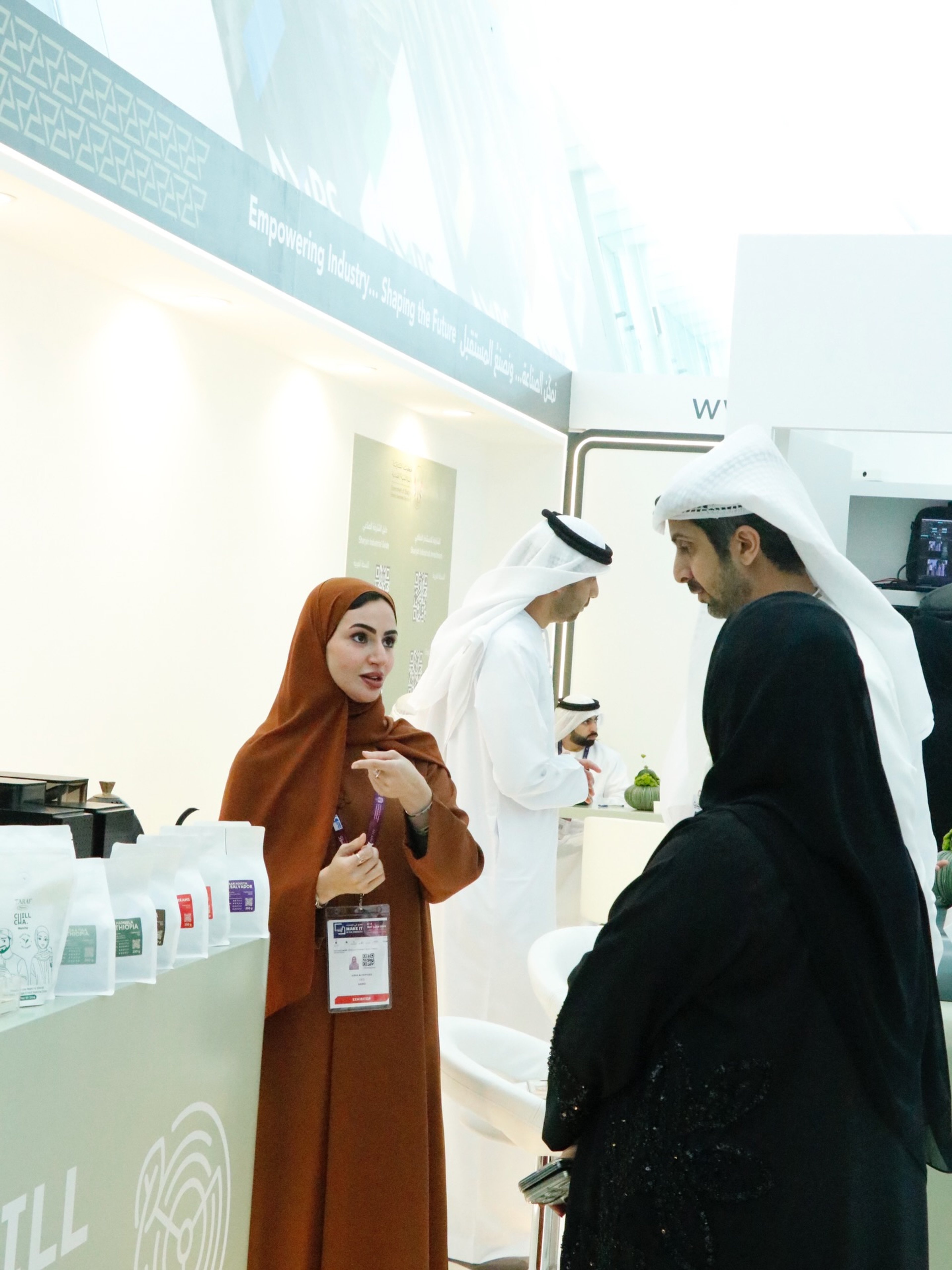 A Berry Roasters host presenting at the World of Coffee Dubai booth