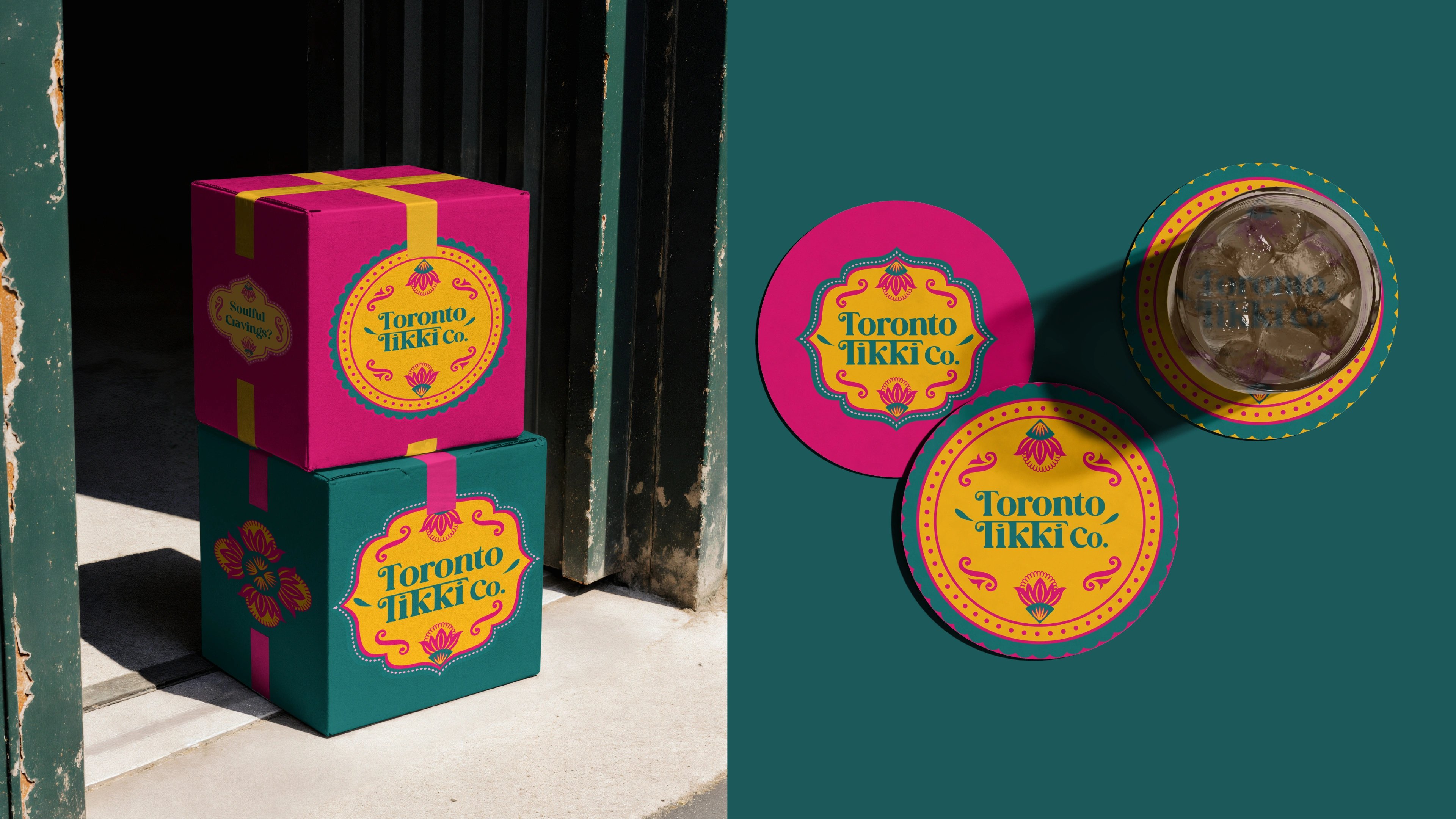 Stacked magenta and teal Toronto Tikki Co. takeout boxes tied with gold ribbon and lotus-crest labels, with branded coasters and an iced drink alongside