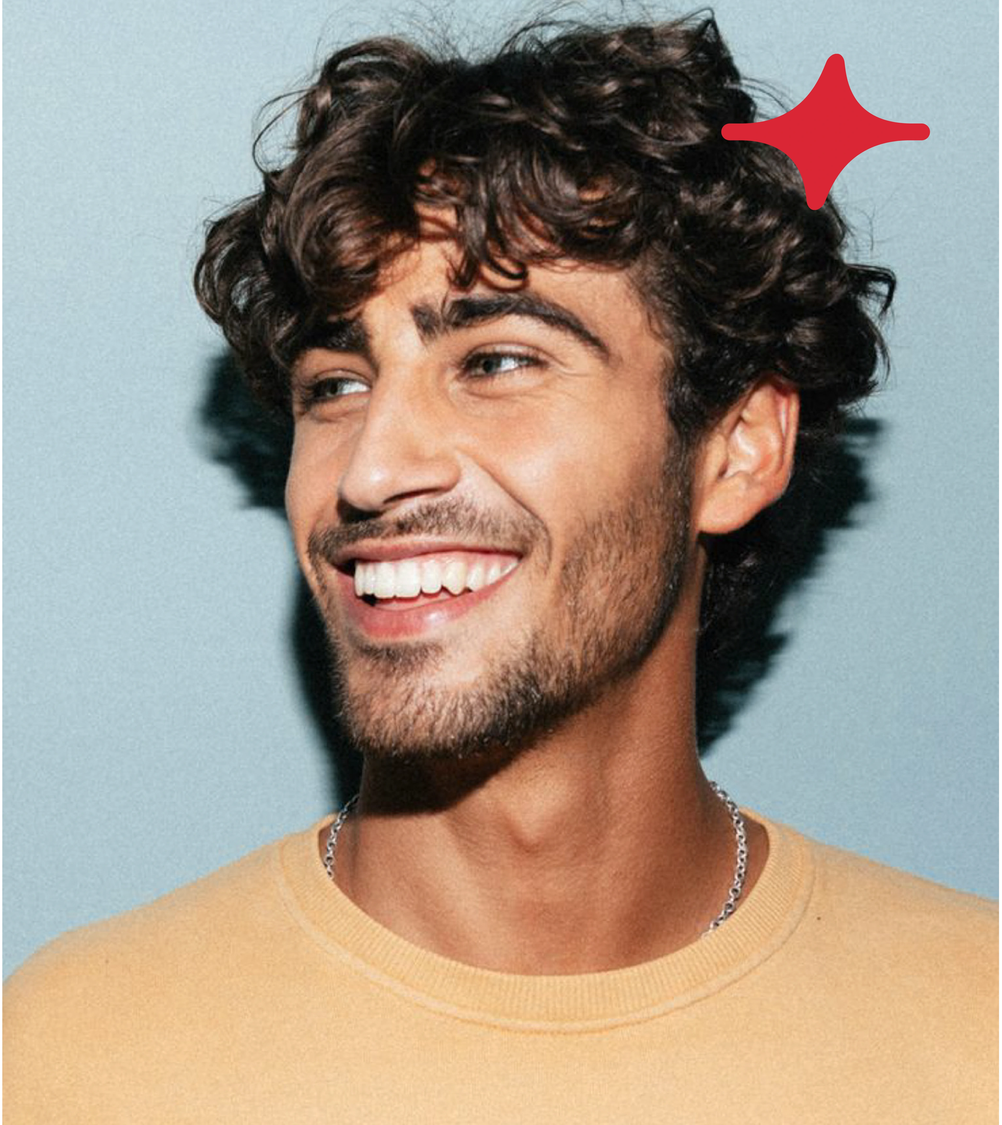 A man smiling on a blue background beside the red OPEARL star mark