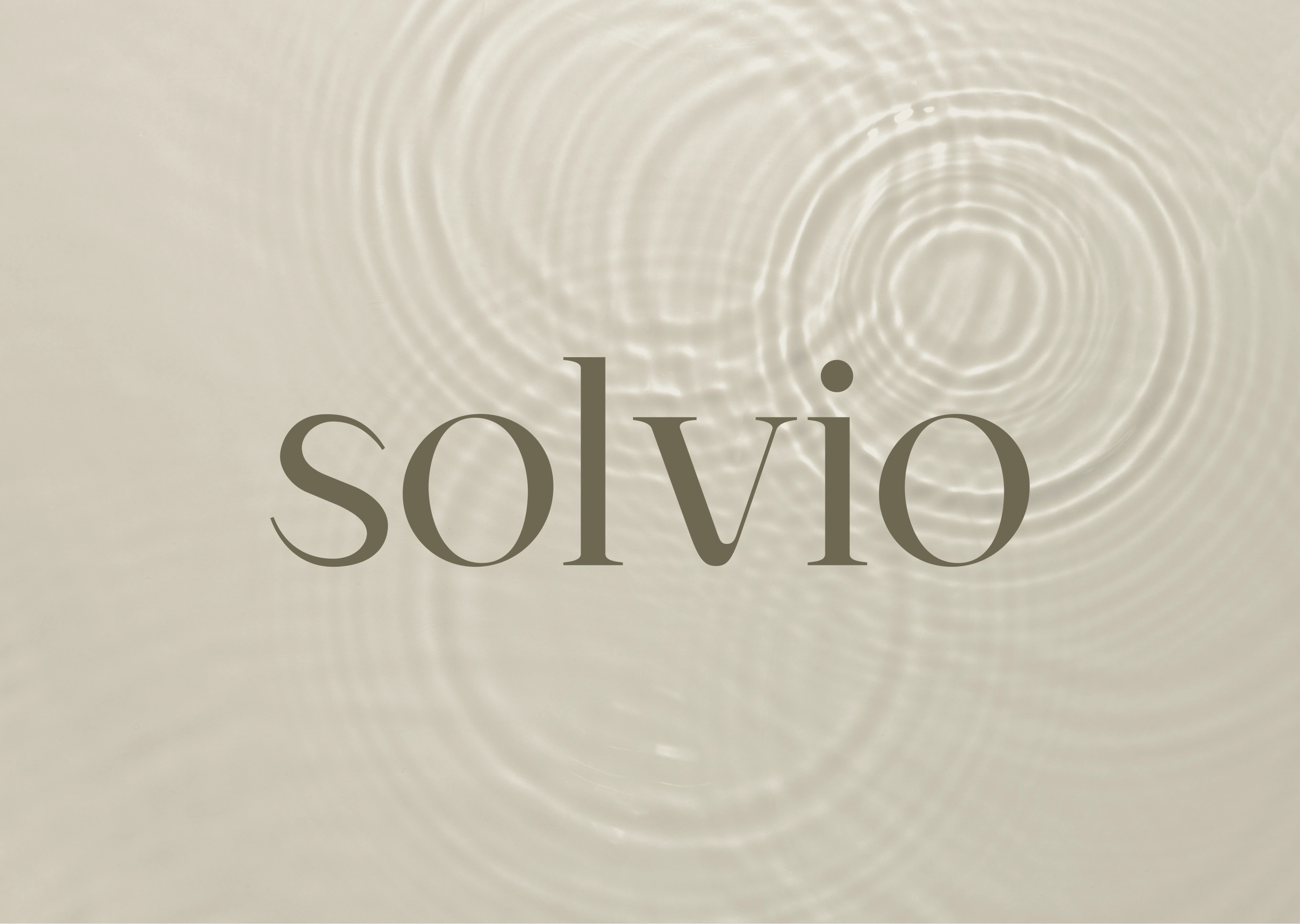 Solvio spiral mark over concentric water ripples on beige