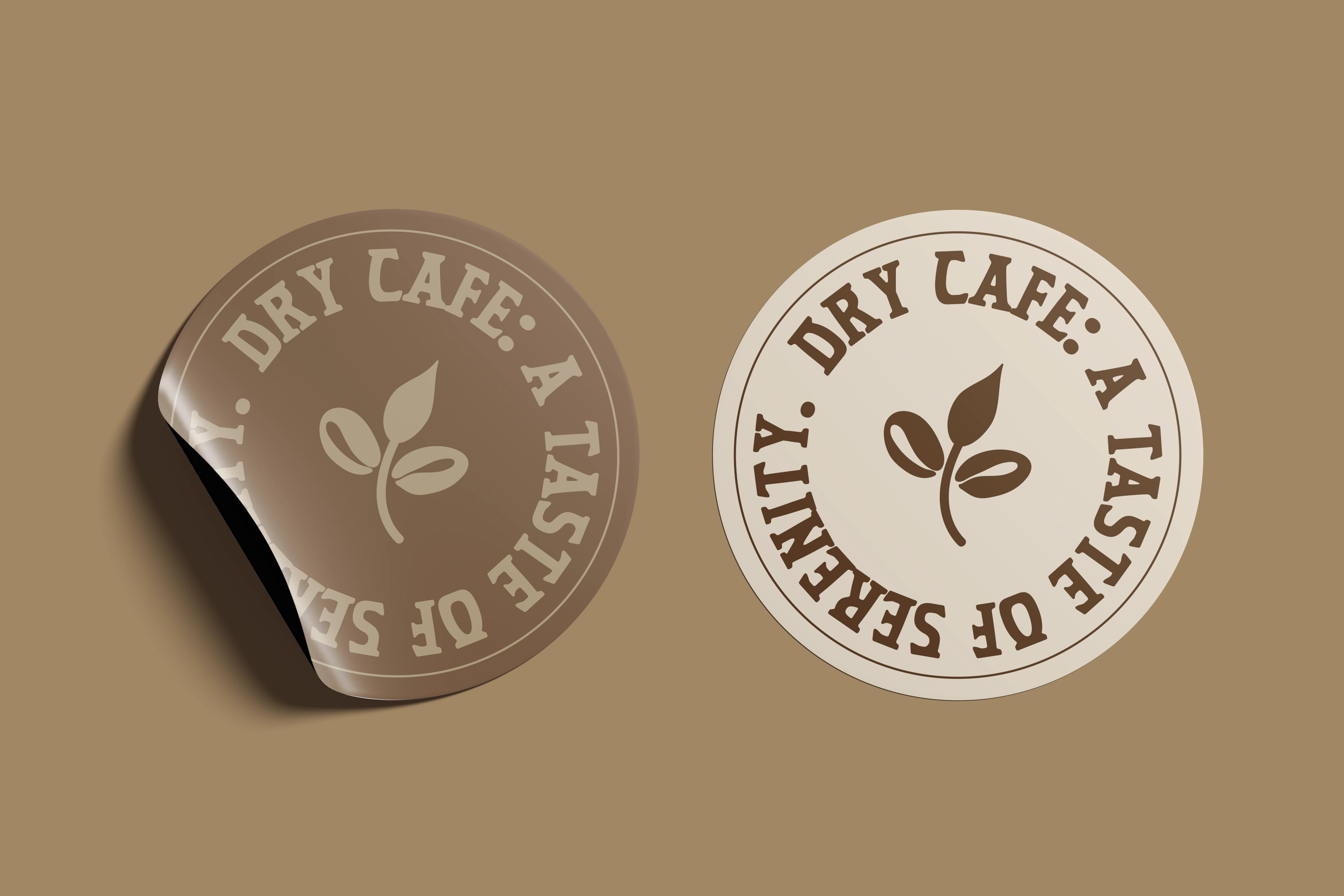 Two round Dry Café 'a taste of serenity' stickers on tan