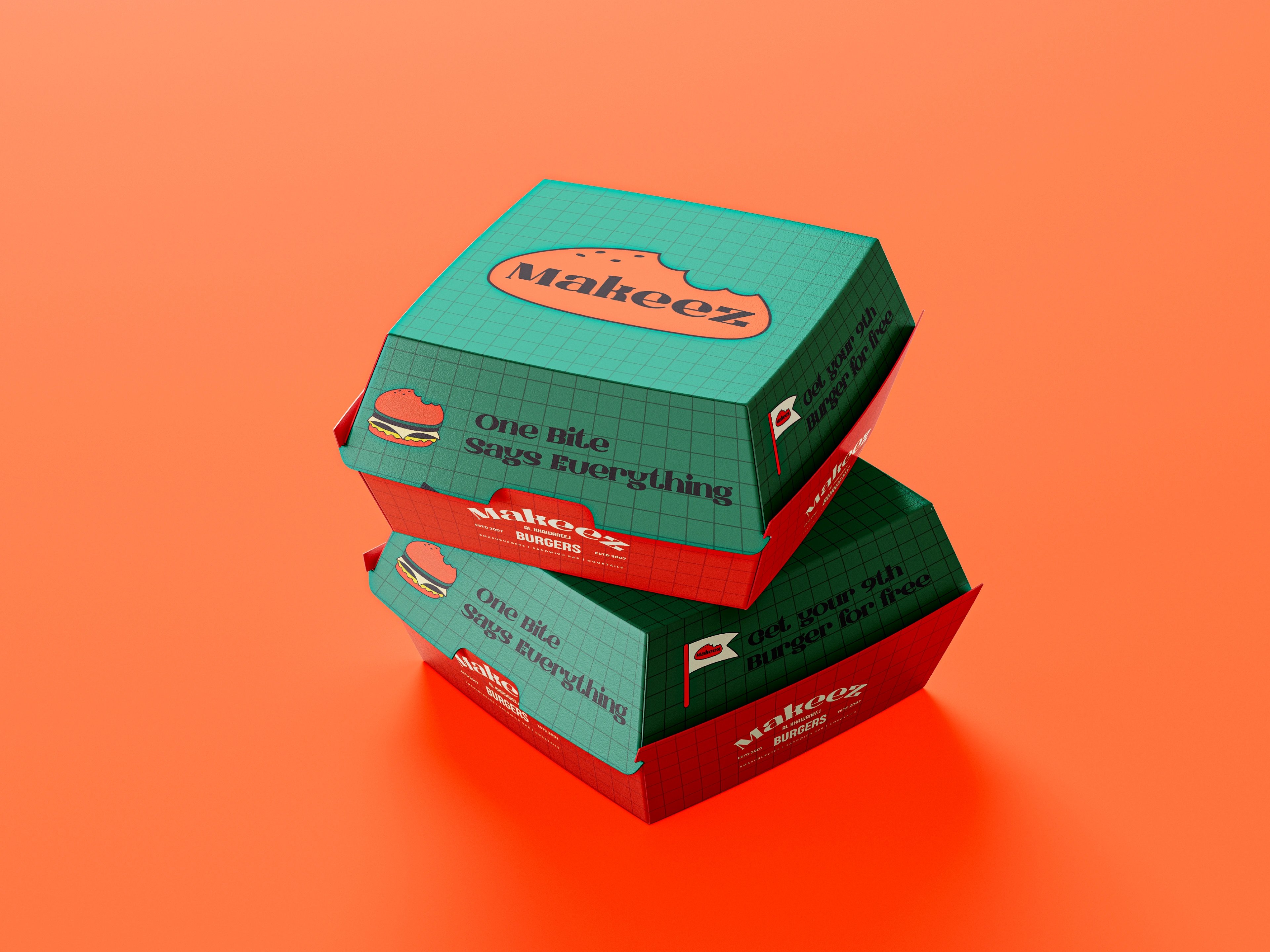 Stacked Makeez burger boxes in green and orange