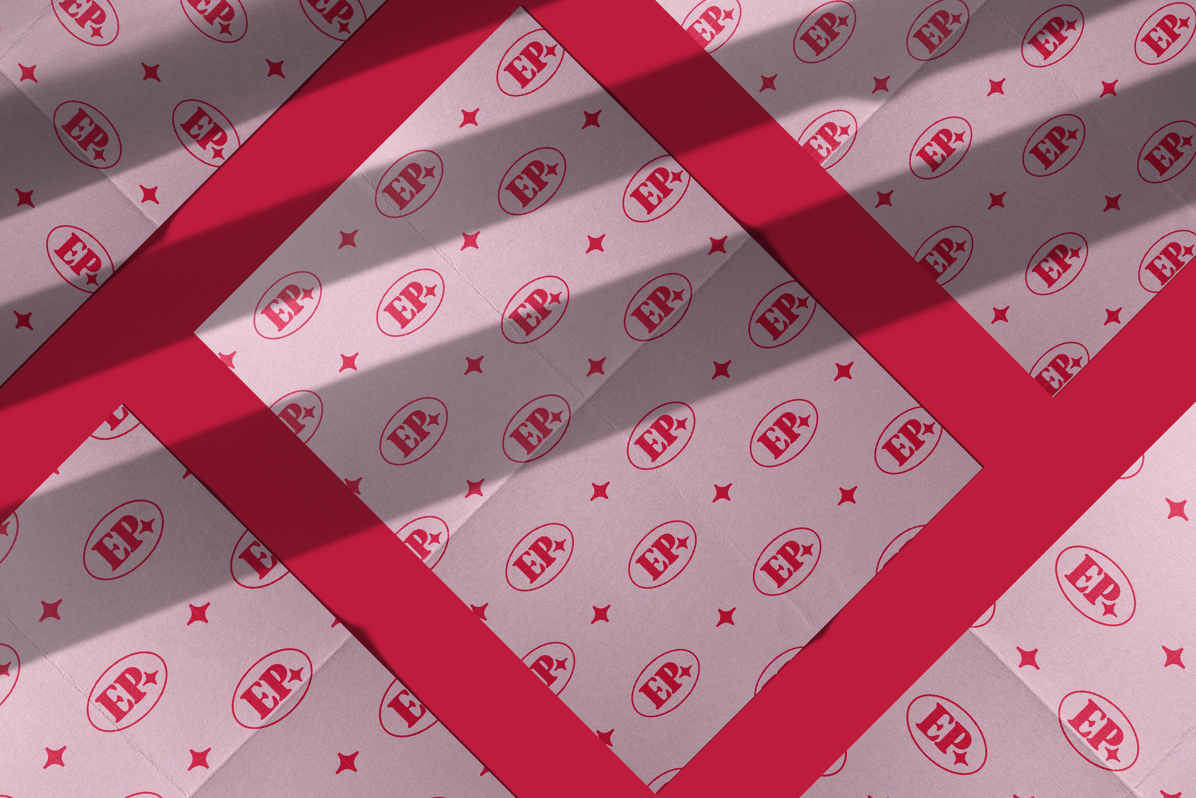 Elyse Potter Photography print pieces scattered on a red diagonal, each carrying the EP monogram pattern