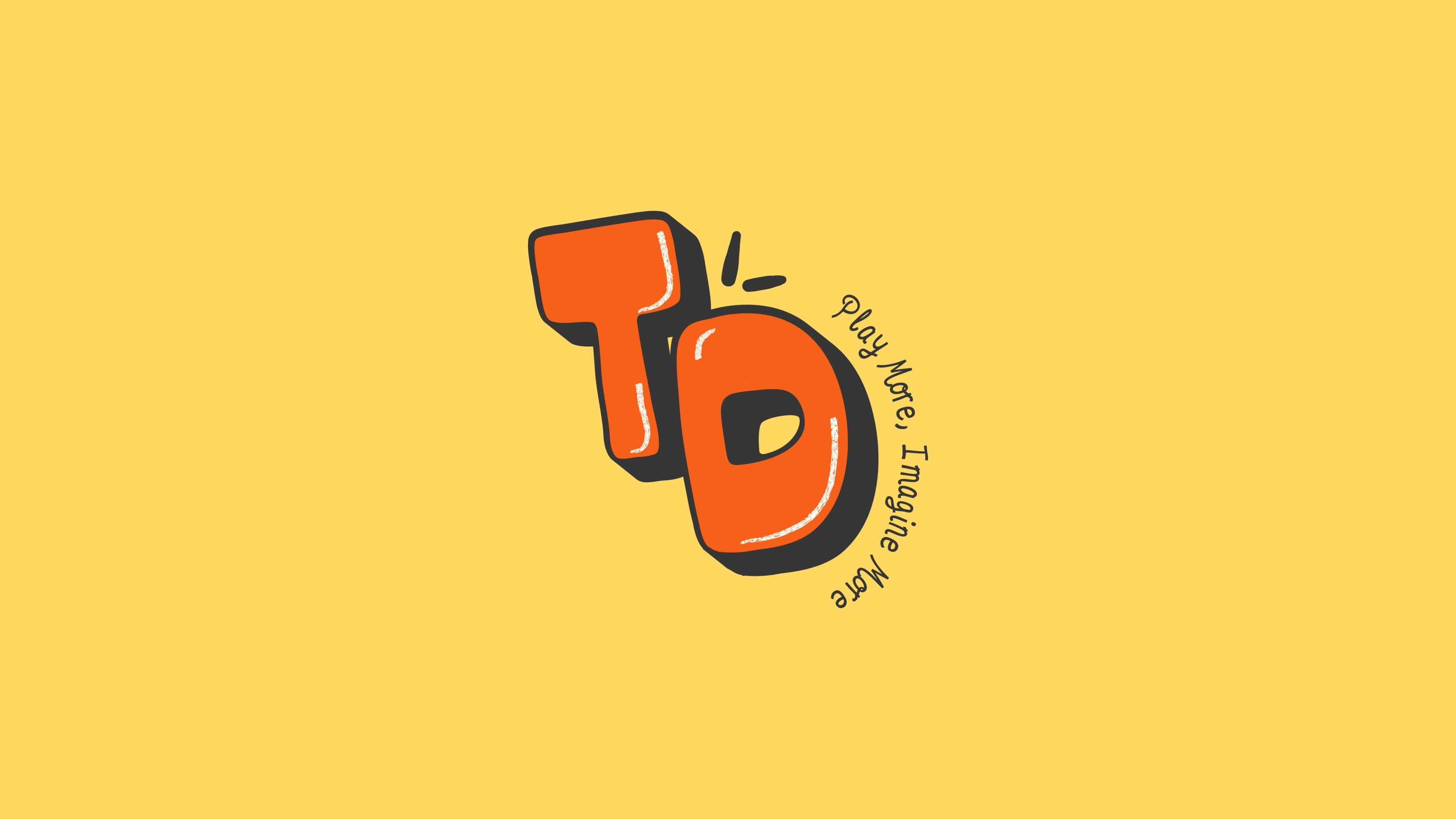 Tebby Dear TD monogram on yellow with the line 'Play More, Imagine More'