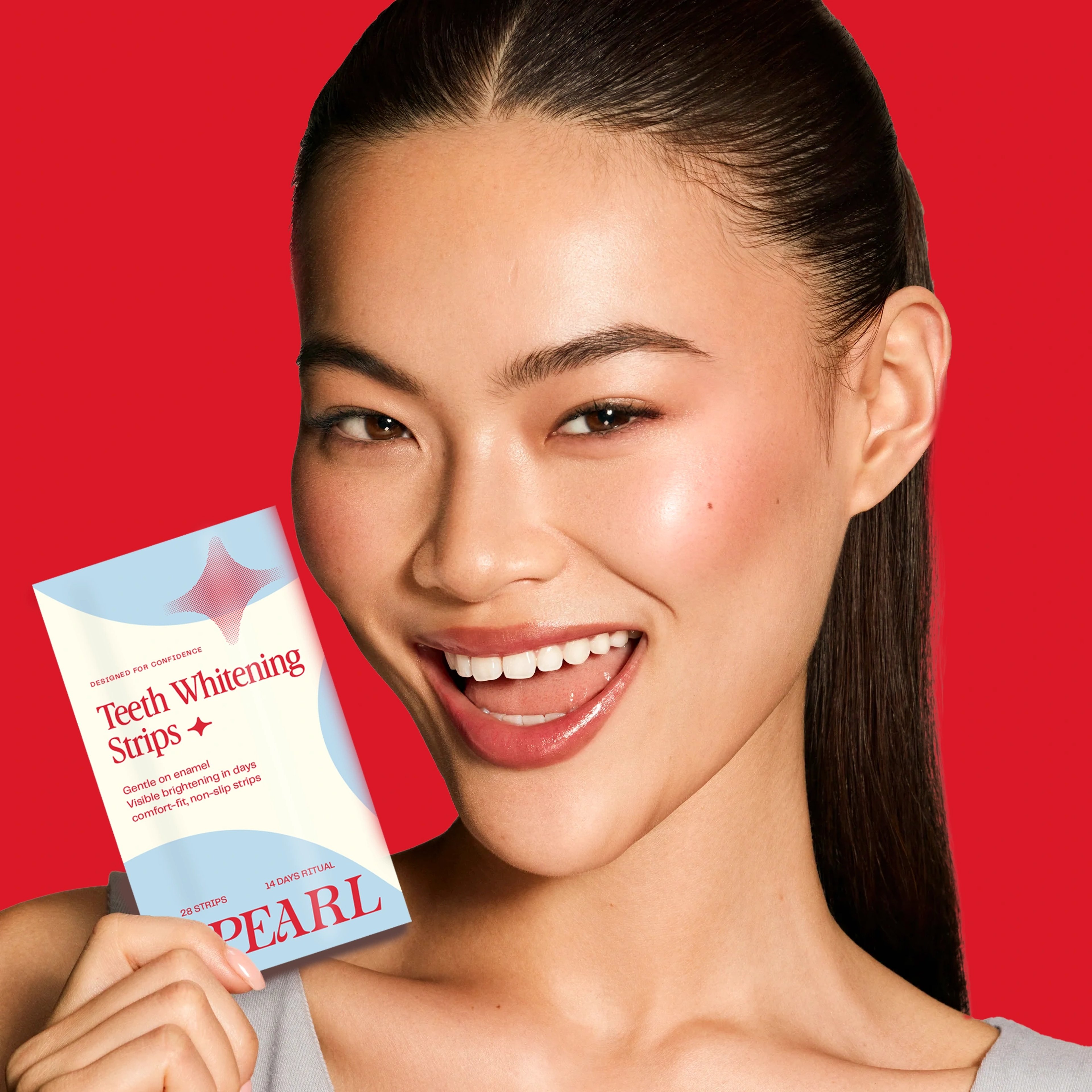A smiling model holding an OPEARL teeth-whitening strips box against a bold red background