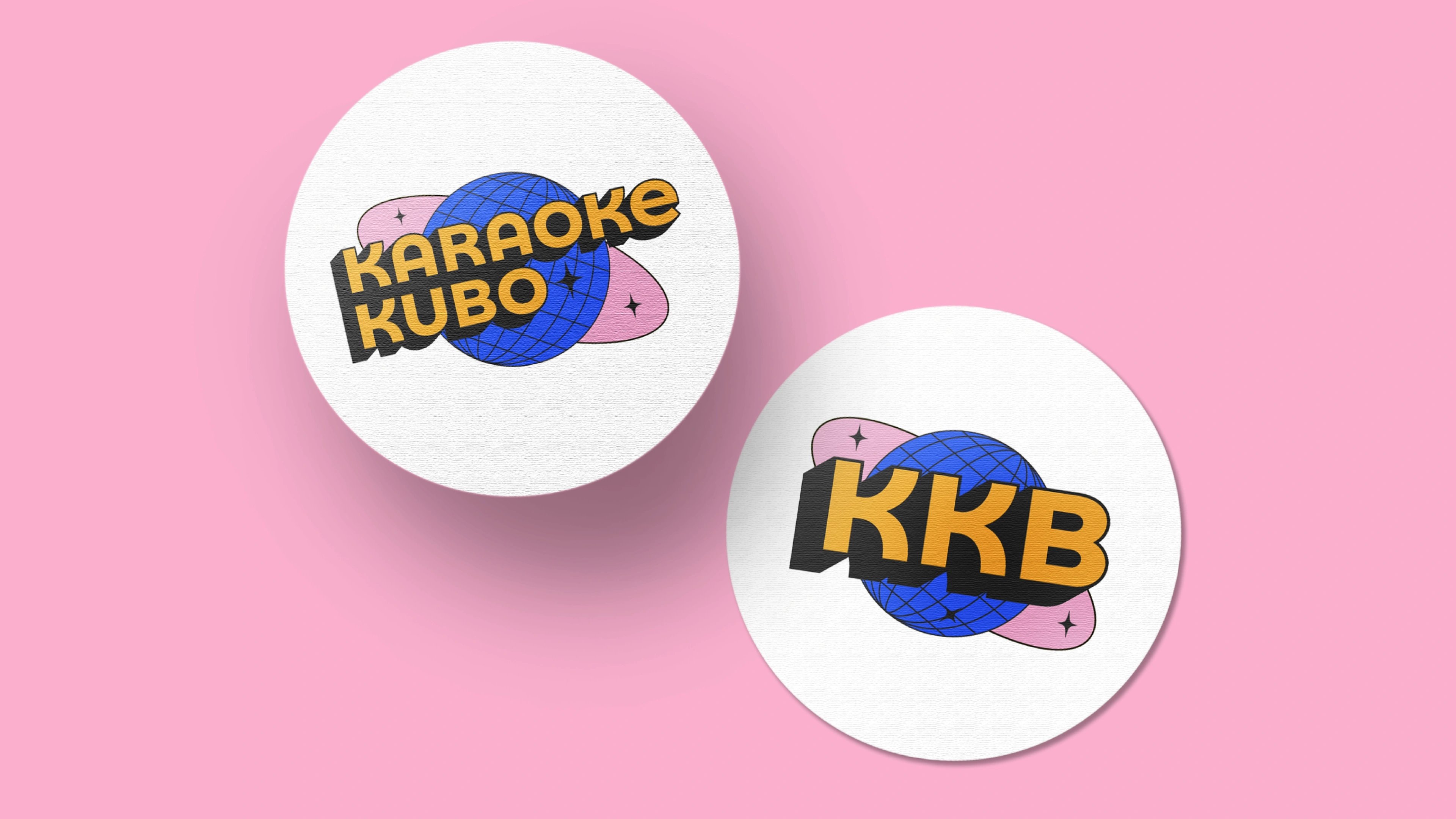 Two circular Karaoke Kubo stickers, the full wordmark and the KKB monogram, on pink