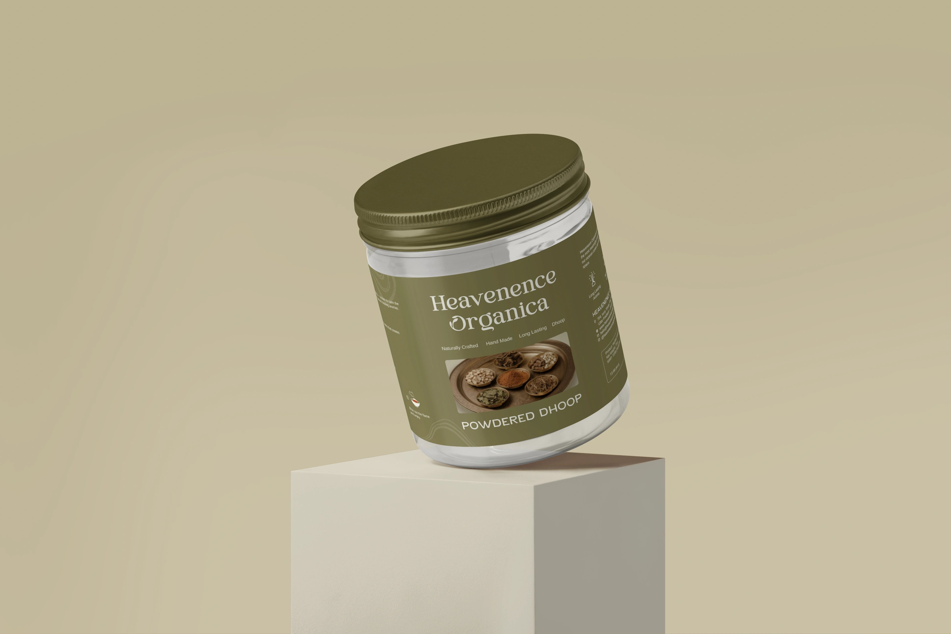 Heavenence Organica Powdered Dhoop in an olive jar, tilted on a cream plinth