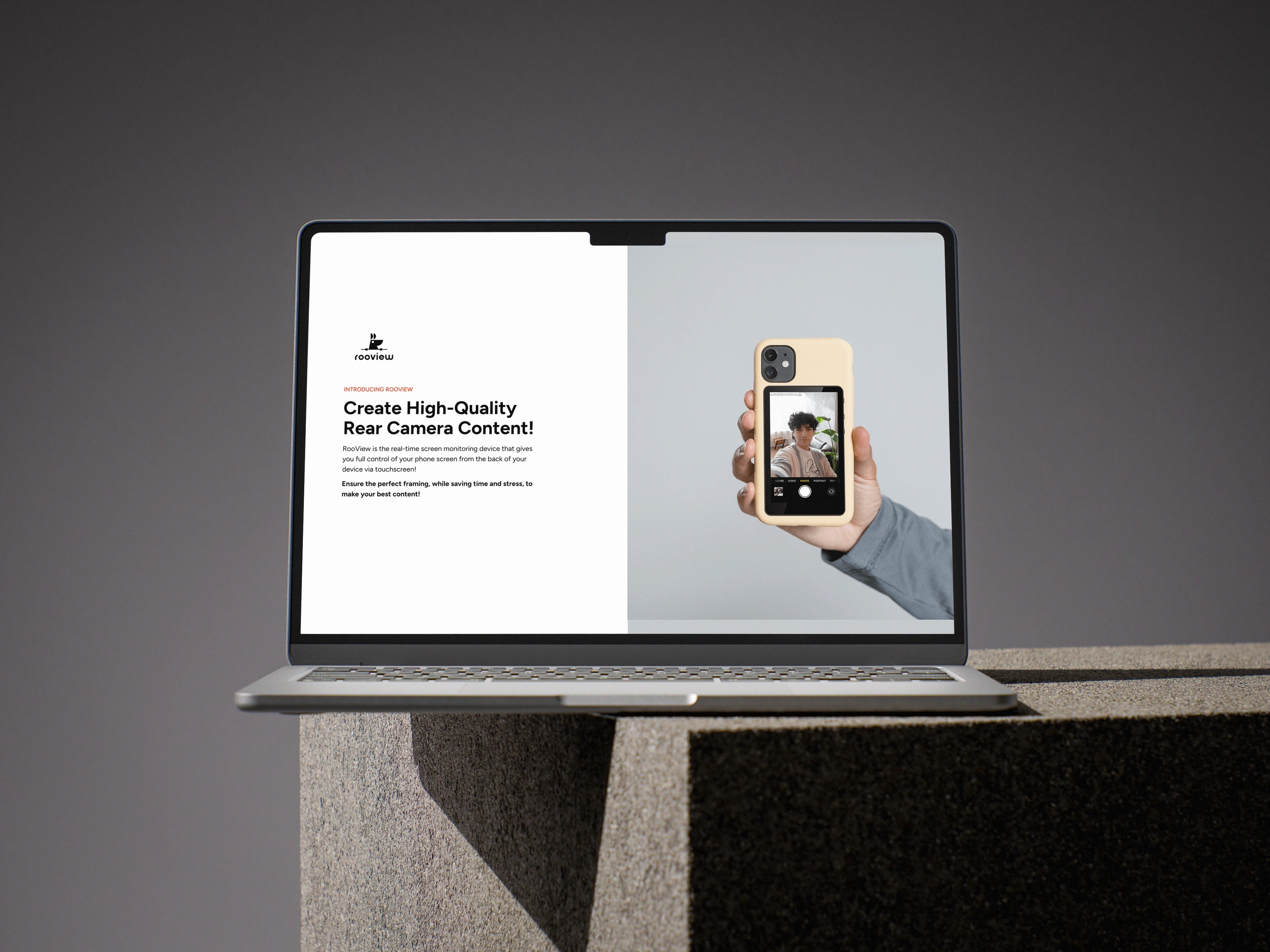 the RooView launch page on a laptop — 'create high-quality rear camera content' beside a hand holding a filming phone